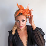 Orange crystal feather fascinator hat