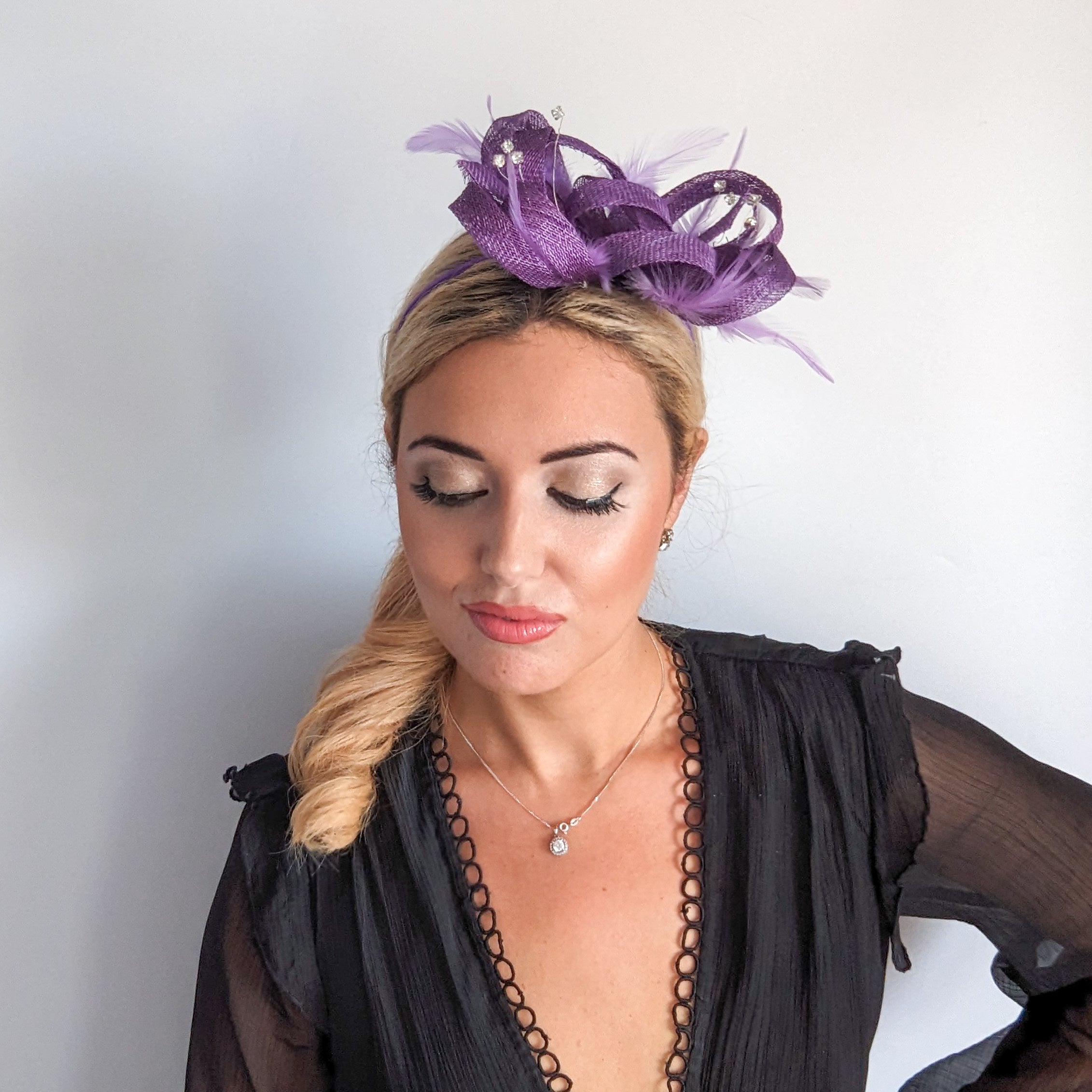 Royal purple crystal feather fascinator hat