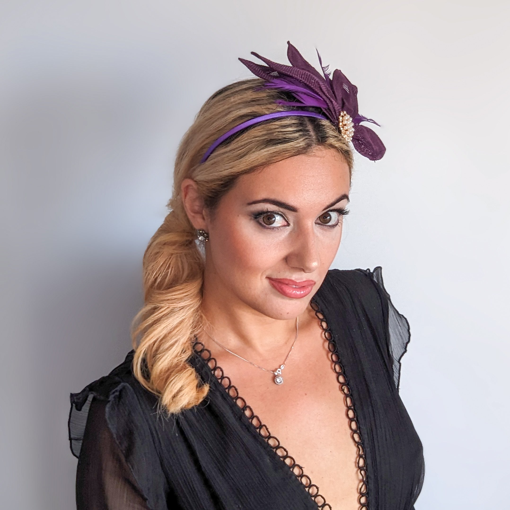 Dark plum purple feather petal fan fascinator hat