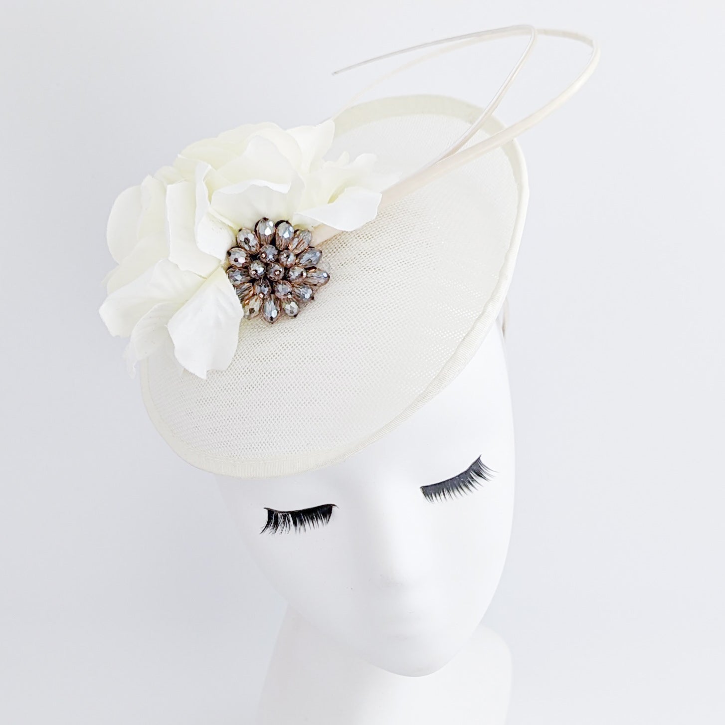 Cream flower disc saucer fascinator hat