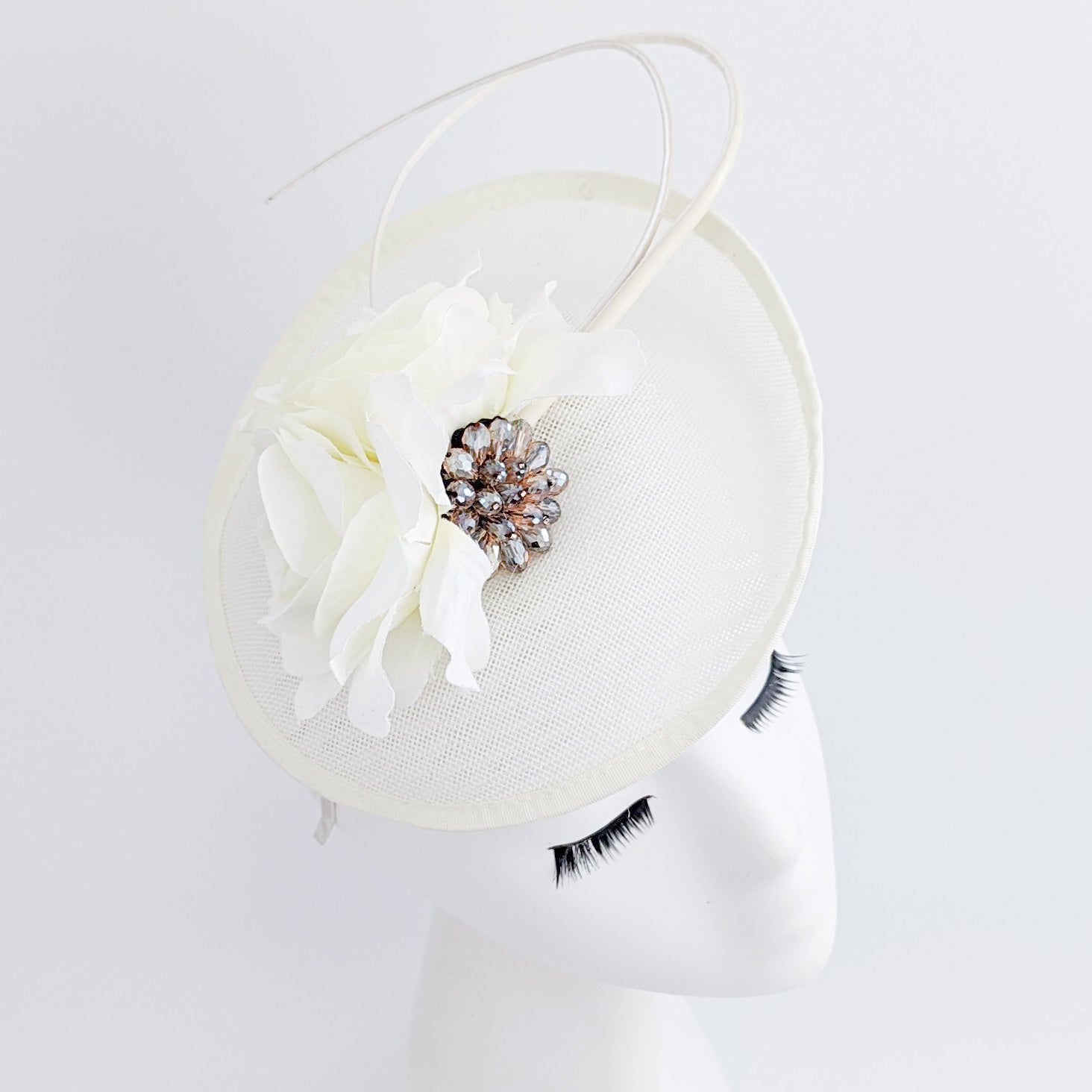 Cream flower disc saucer fascinator hat