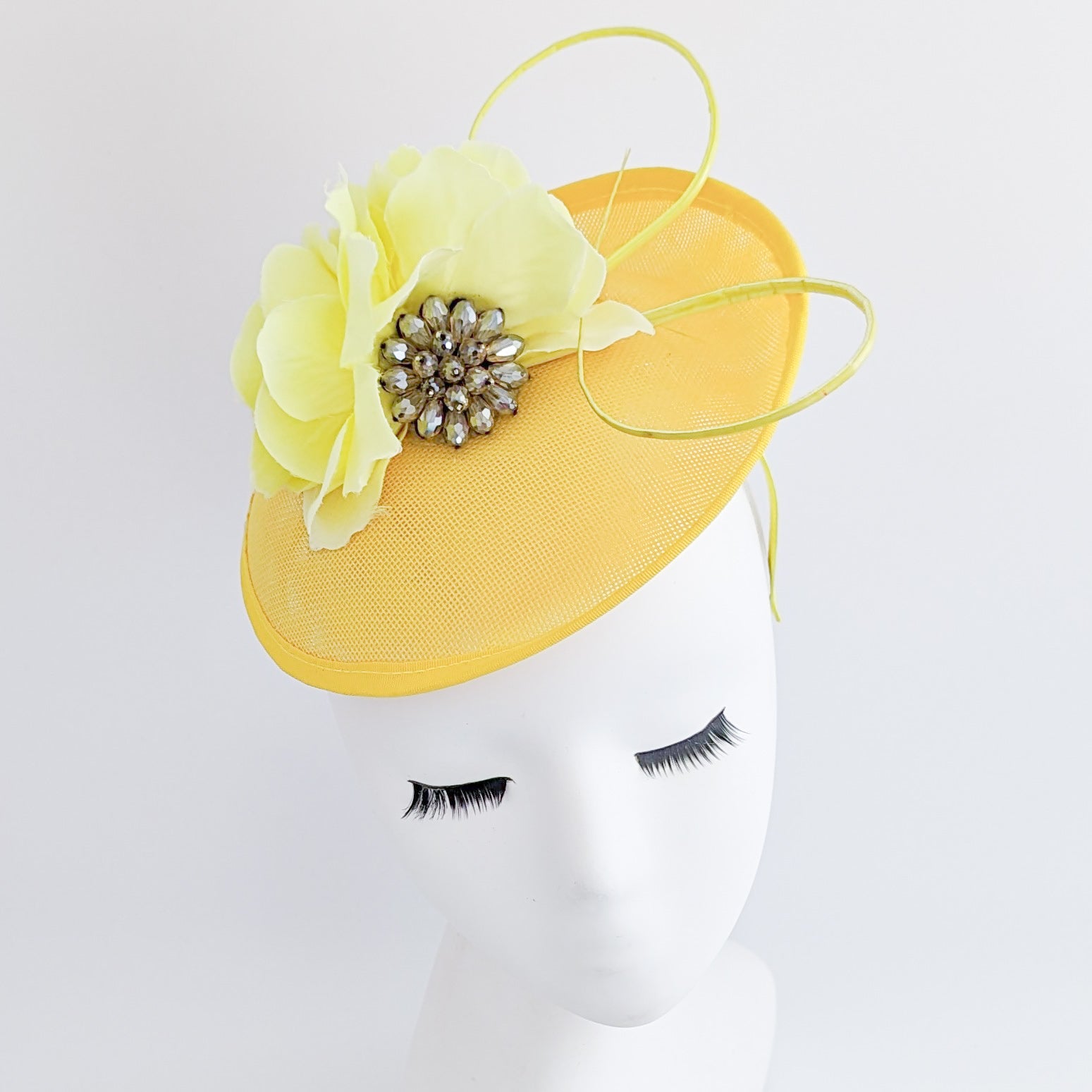 Yellow flower disc saucer fascinator hat