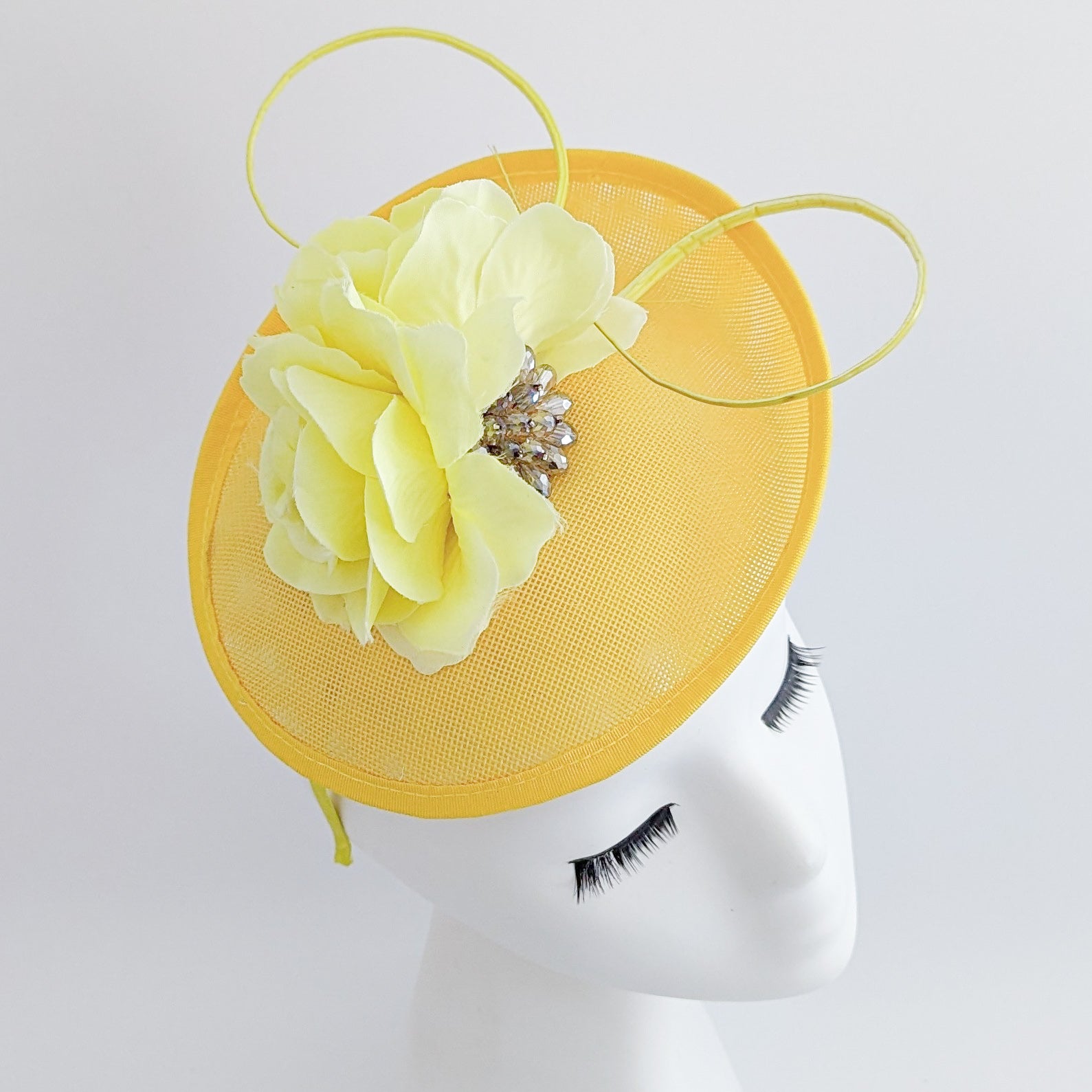 Yellow flower disc saucer fascinator hat