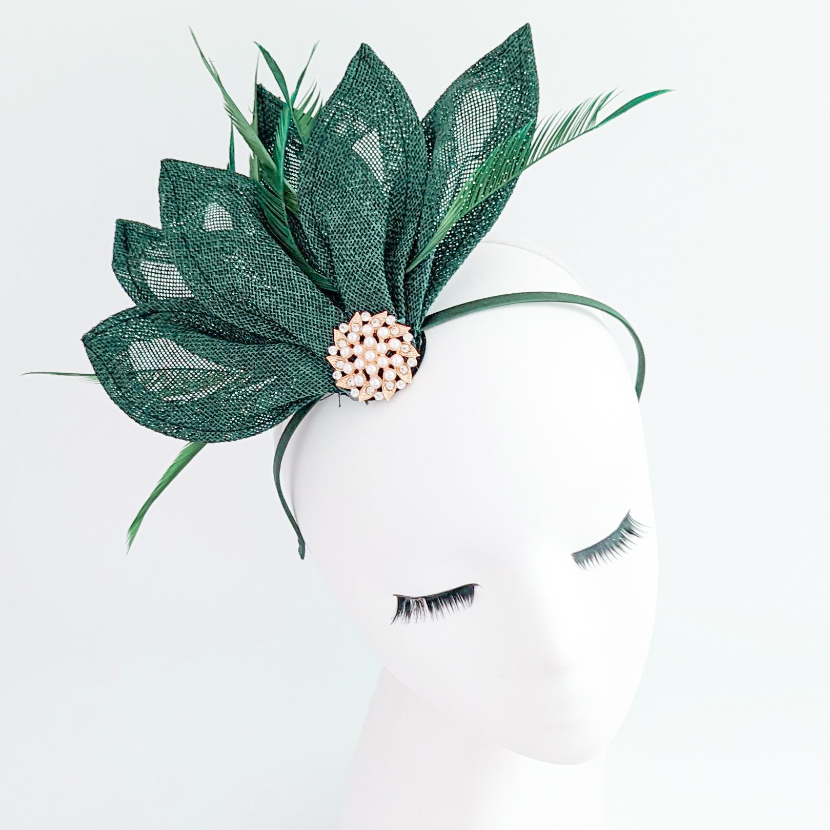 Dark emerald green feather petal fan fascinator hat