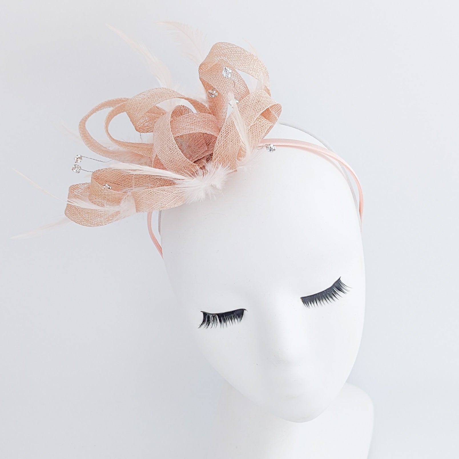 Light peach pink crystal feather fascinator hat