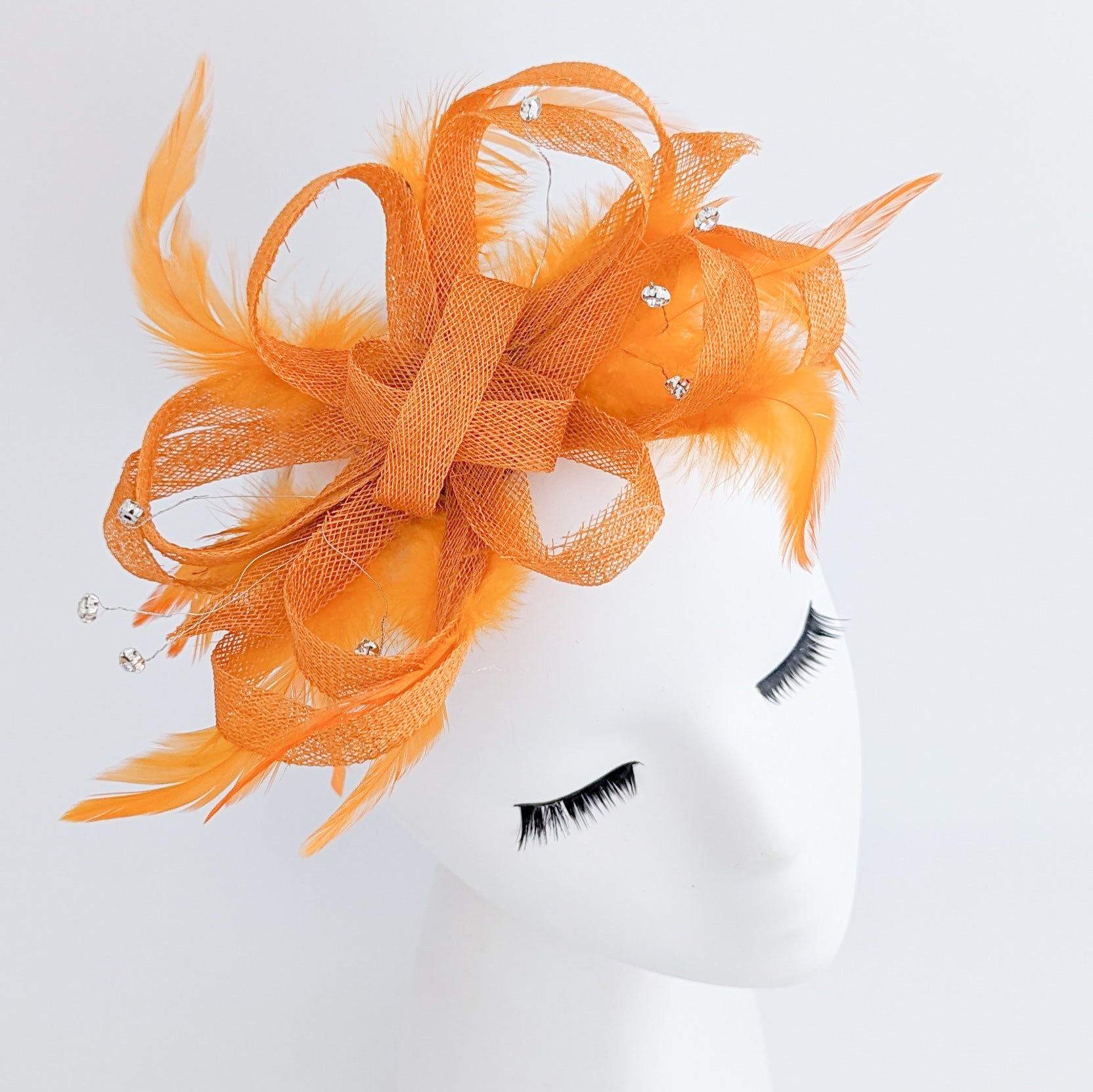 Orange crystal feather fascinator hat