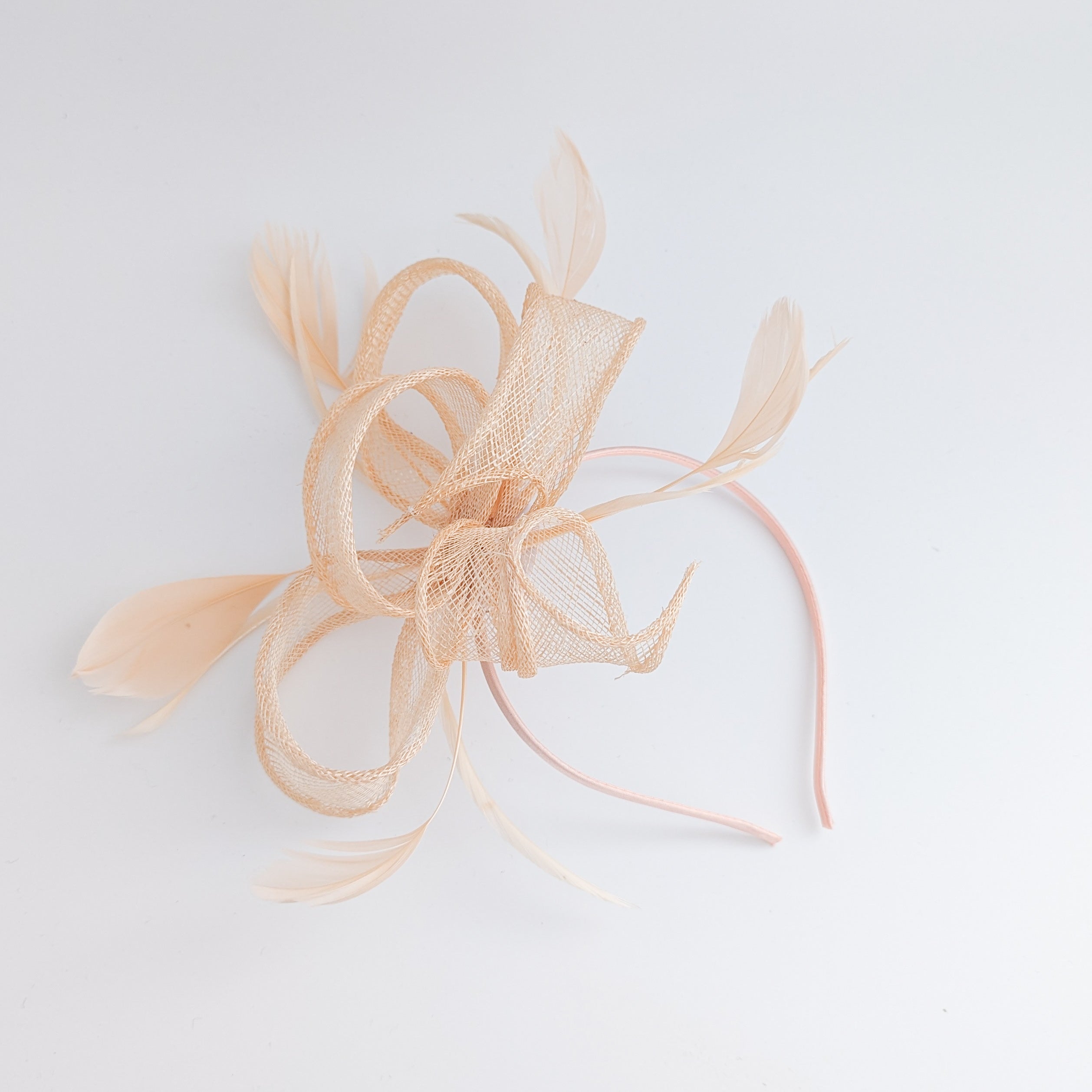 Light peach feather fascinator hat