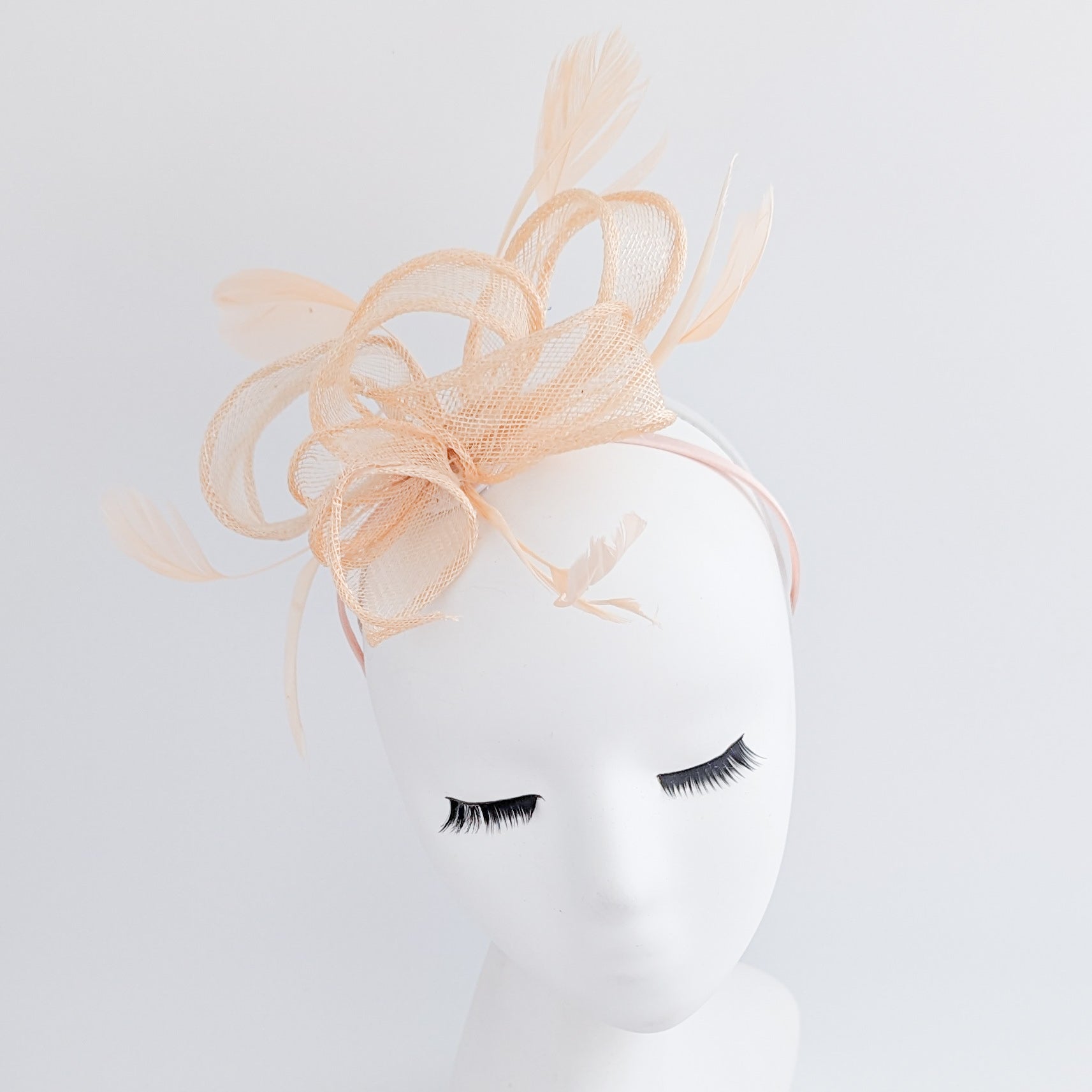 Light peach feather fascinator hat