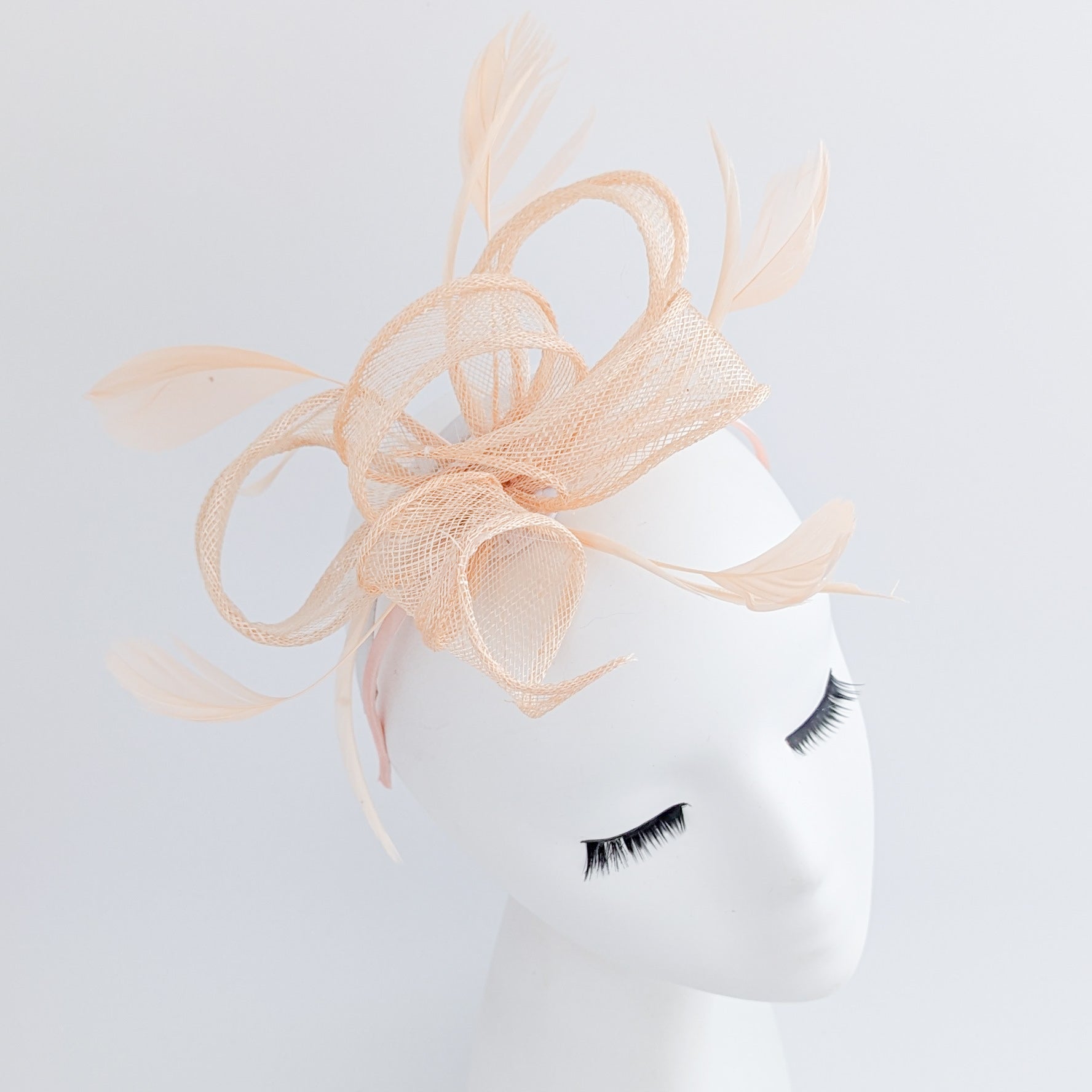 Light peach feather fascinator hat