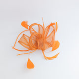 Orange feather fascinator hat