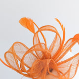 Orange feather fascinator hat