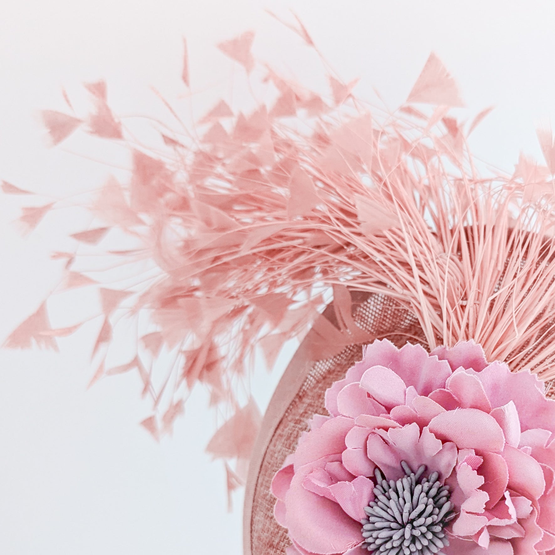 Blush pink flower feather disc saucer fascinator hat