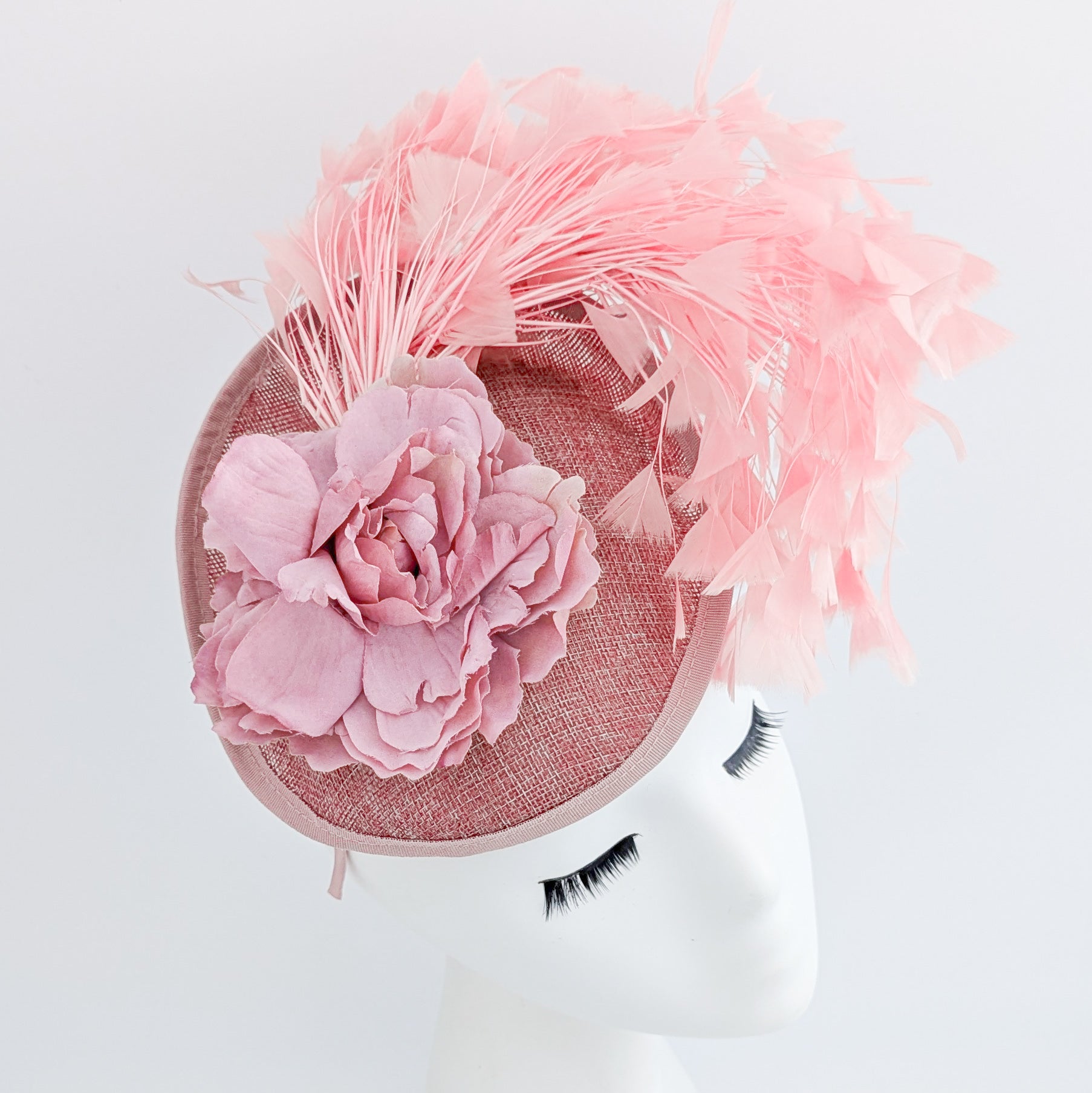 Blush pink flower feather disc saucer fascinator hat