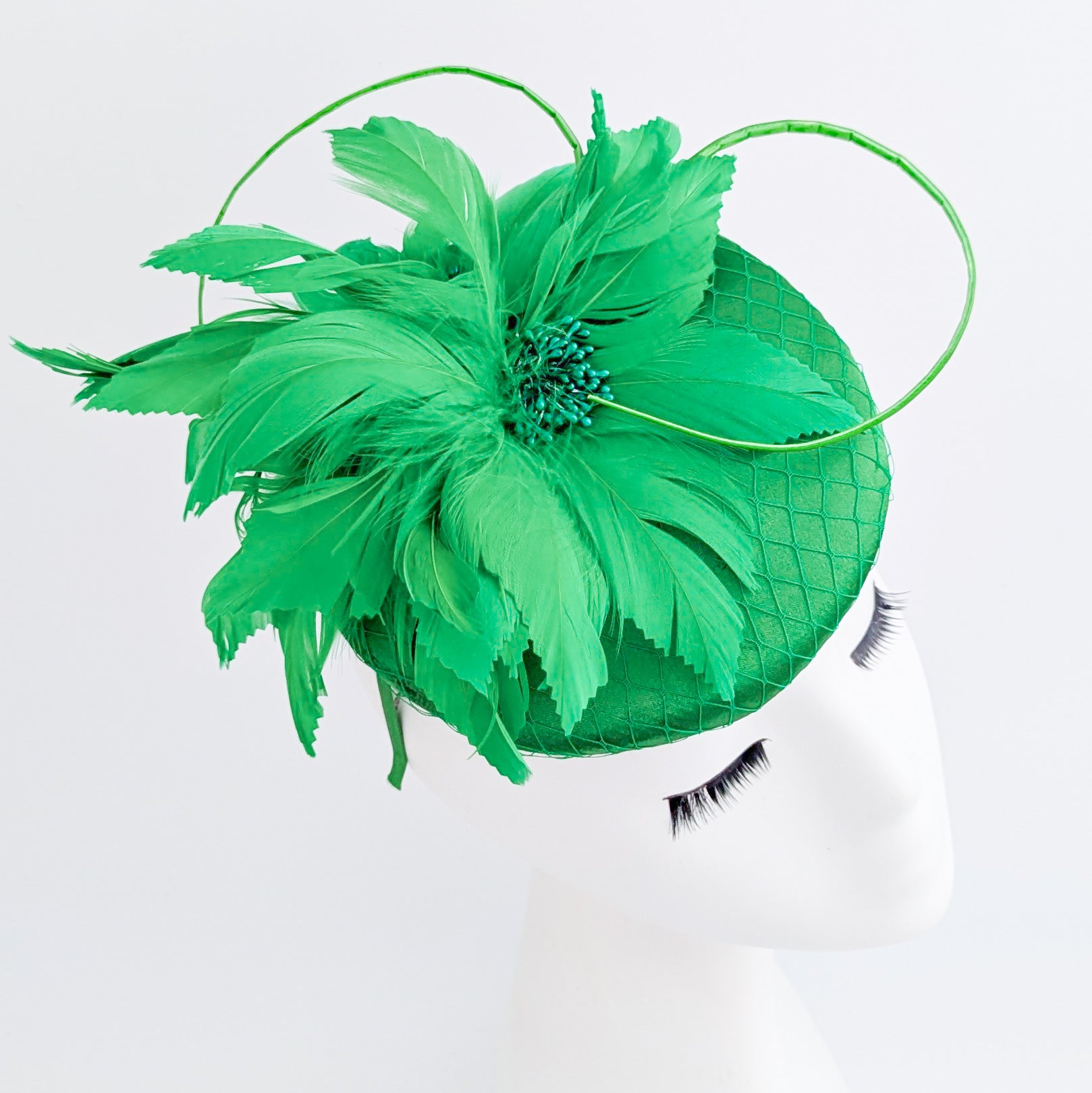 Shamrock green feather satin fascinator hat
