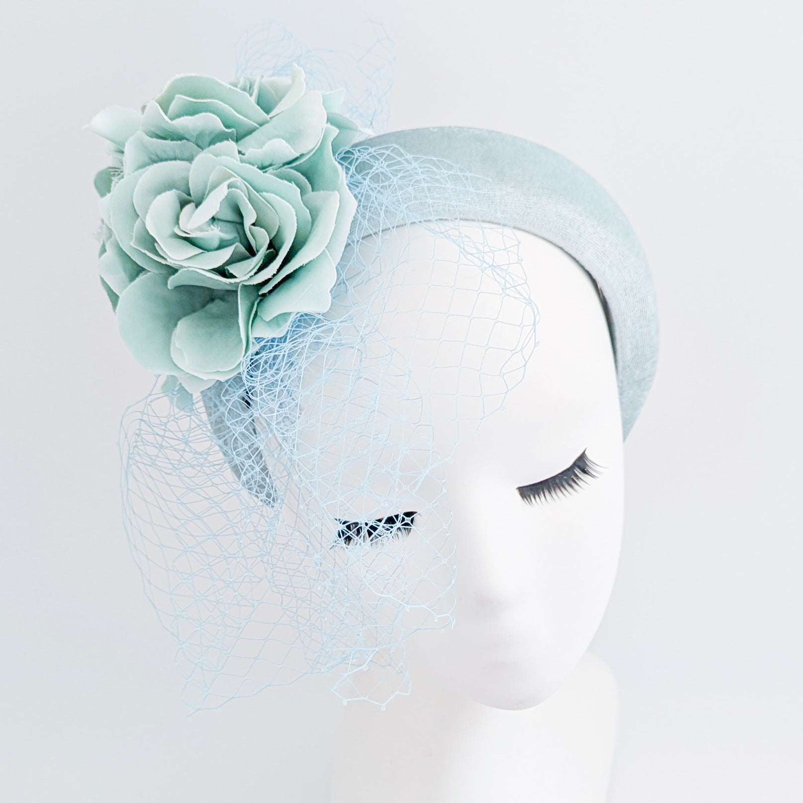 Aquamarine blue flower padded velvet headband fascinator