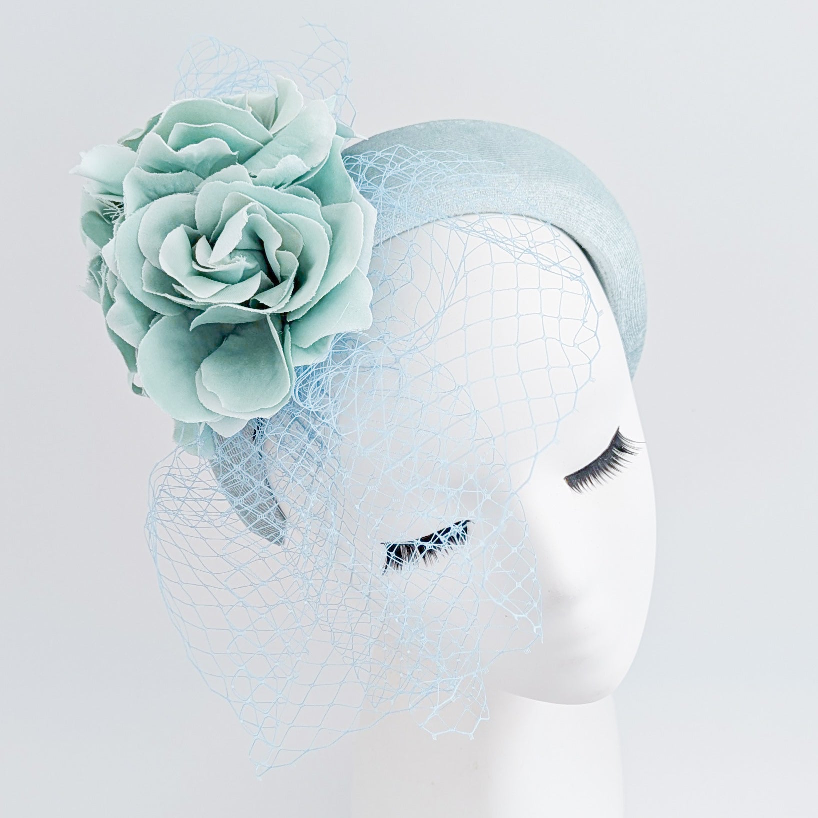 Aquamarine blue flower padded velvet headband fascinator