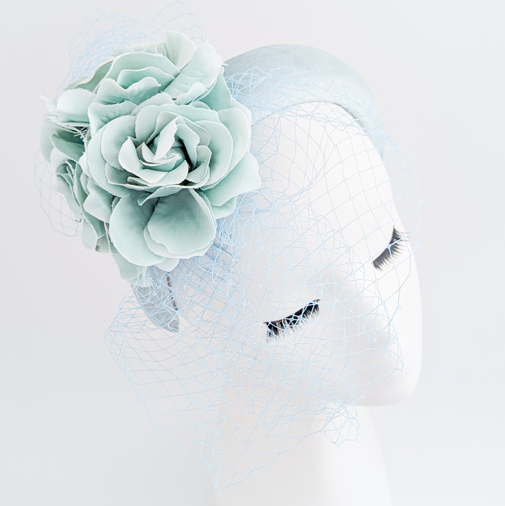 Aquamarine blue flower padded velvet headband fascinator