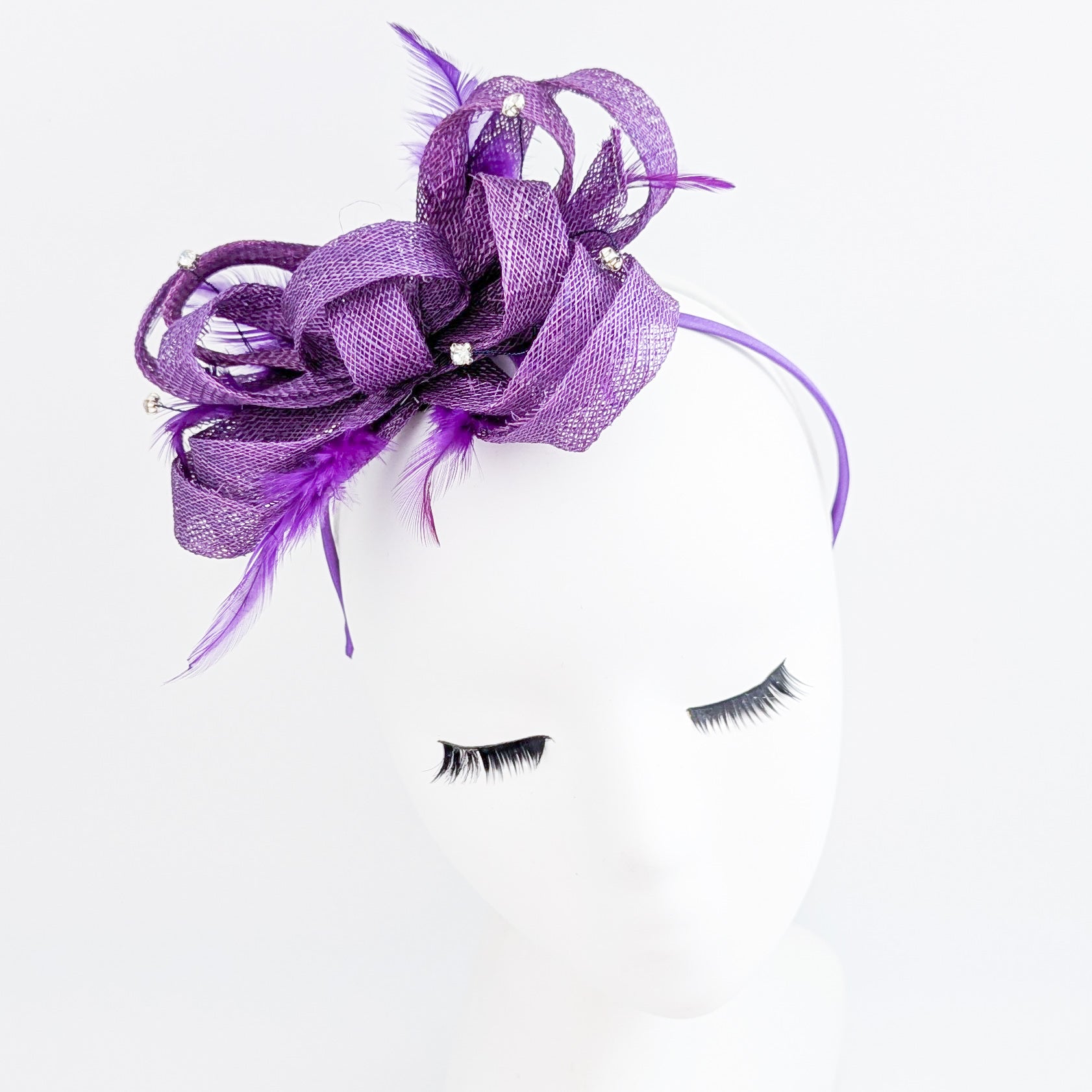 Royal purple crystal feather fascinator hat