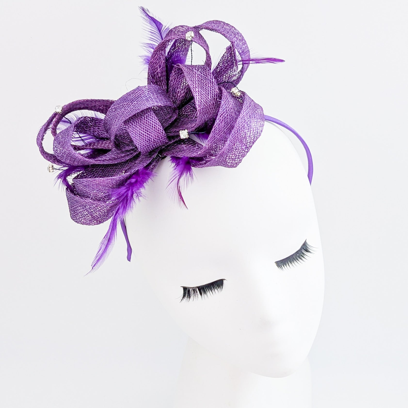 Royal purple crystal feather fascinator hat