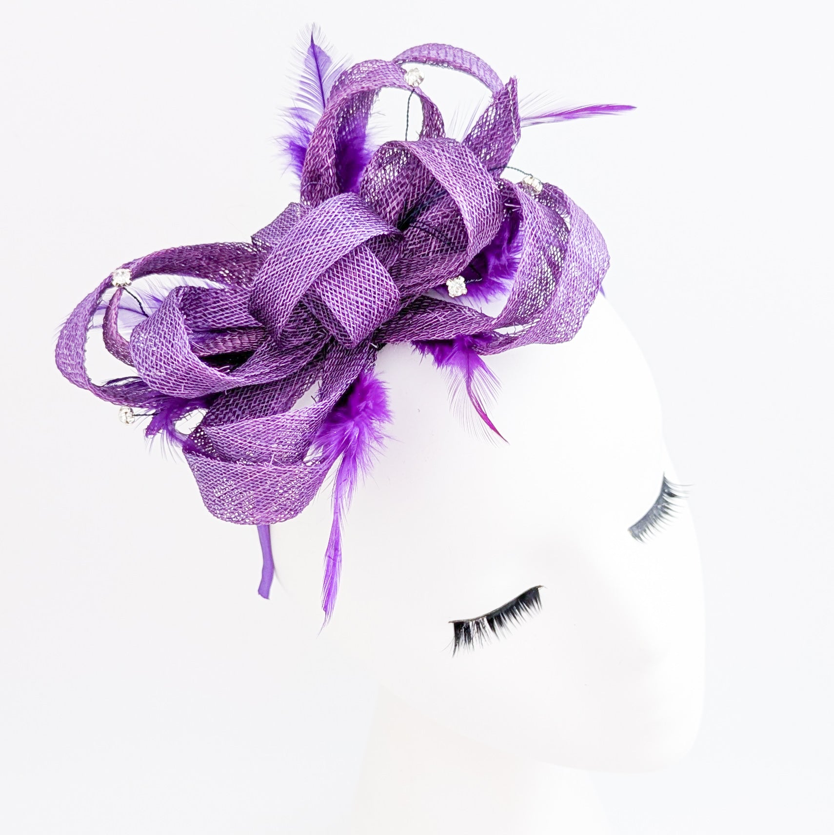 Royal purple crystal feather fascinator hat
