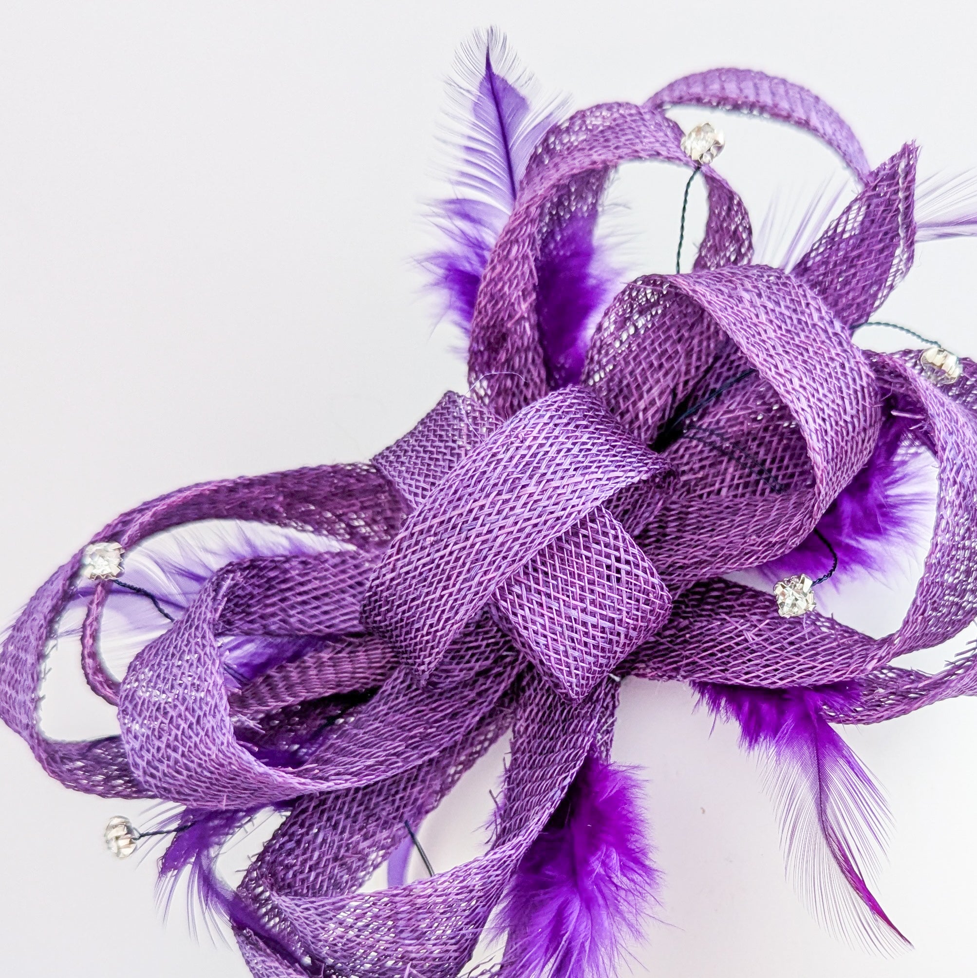 Royal purple crystal feather fascinator hat