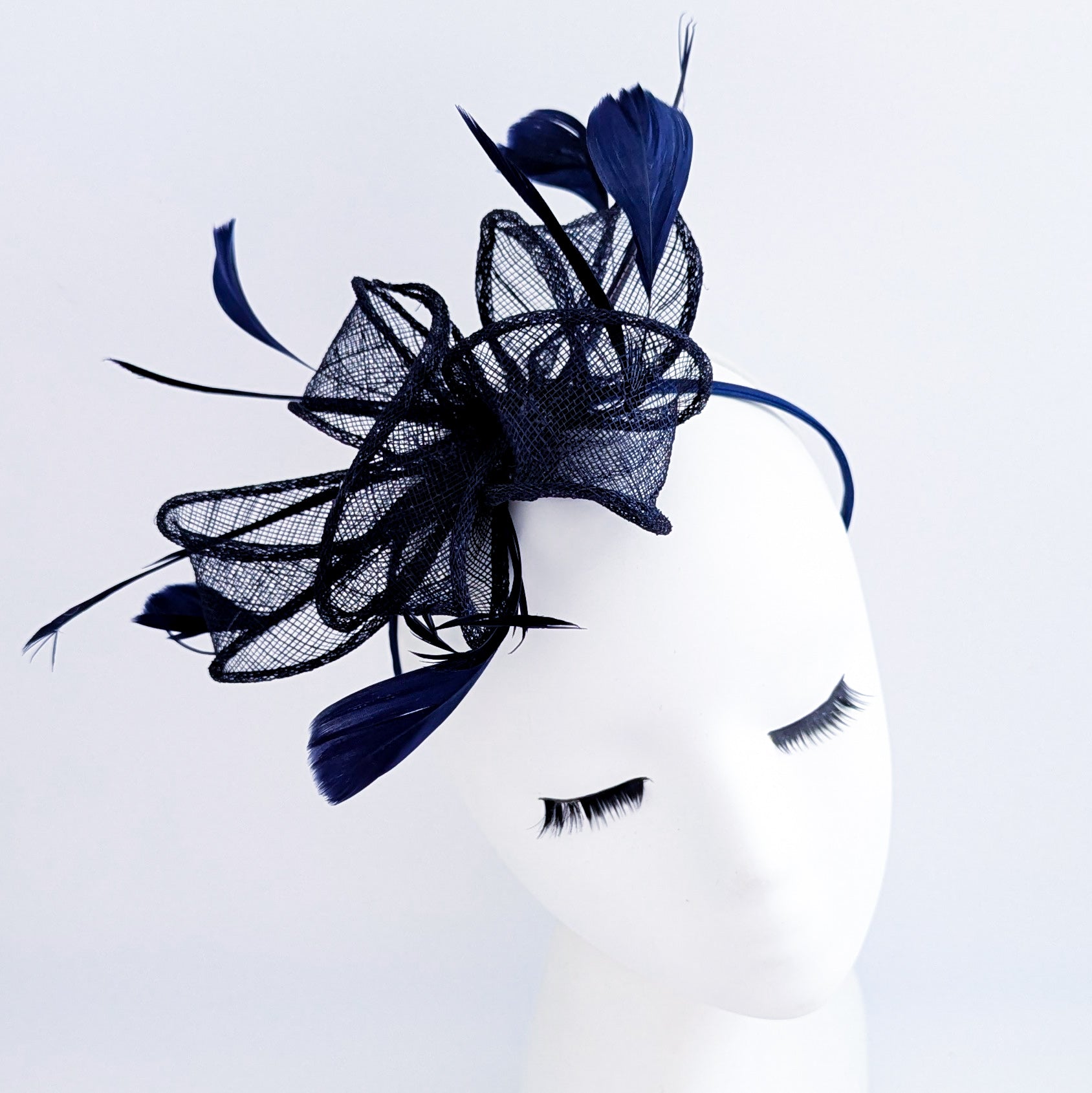 Navy blue feather fascinator hat