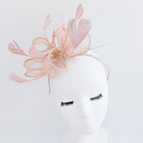 Light peach pink feather fascinator hat
