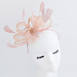 Light peach pink feather fascinator hat
