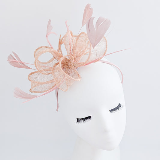 Light peach pink feather fascinator hat