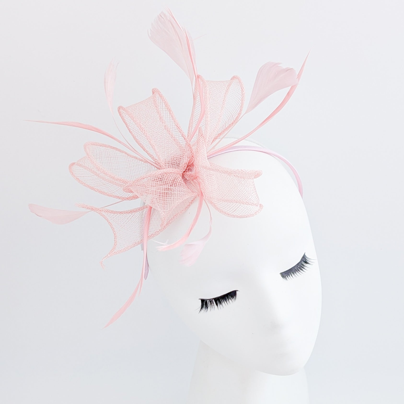 Light pink feather fascinator hat