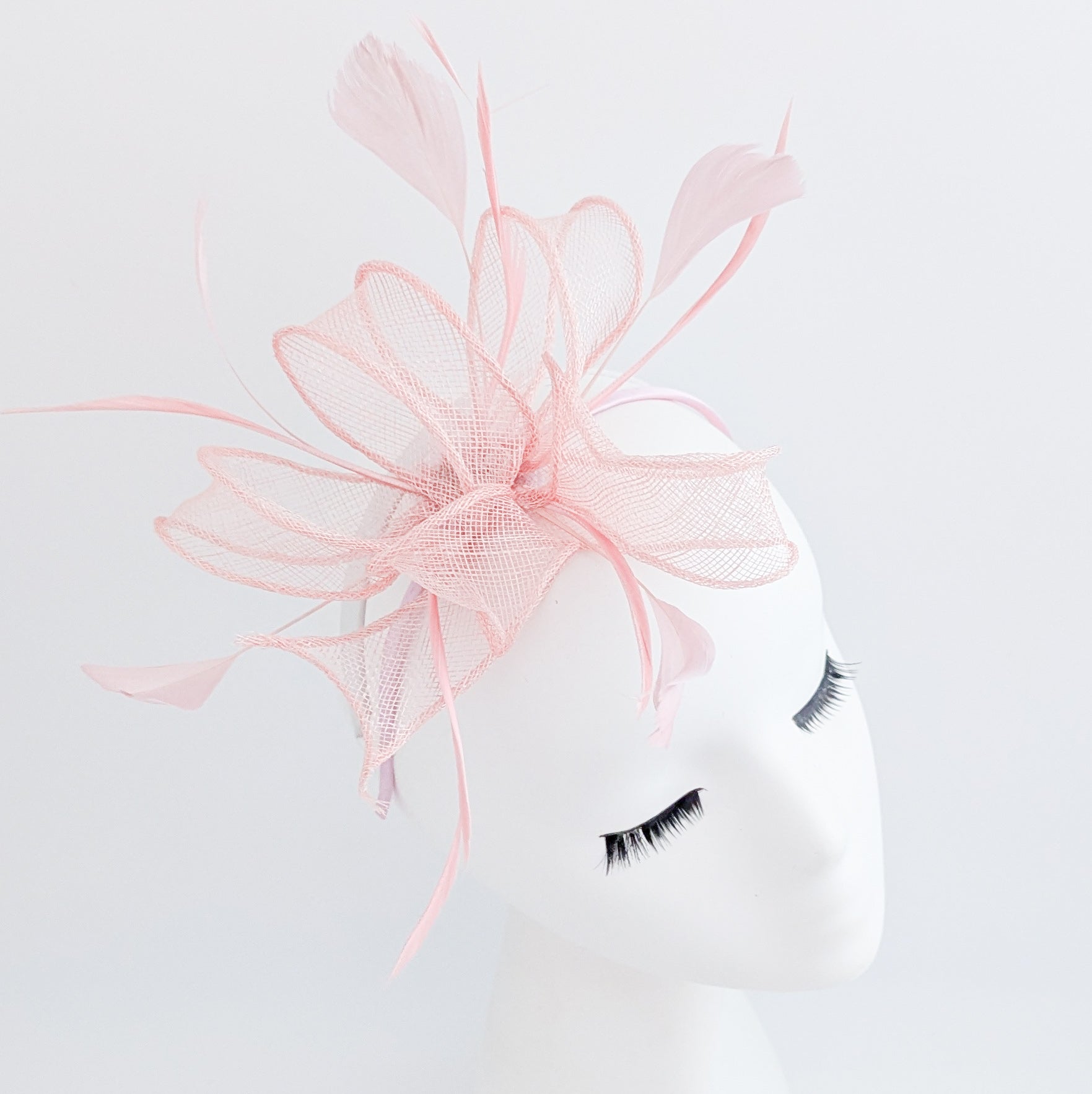 Light pink feather fascinator hat