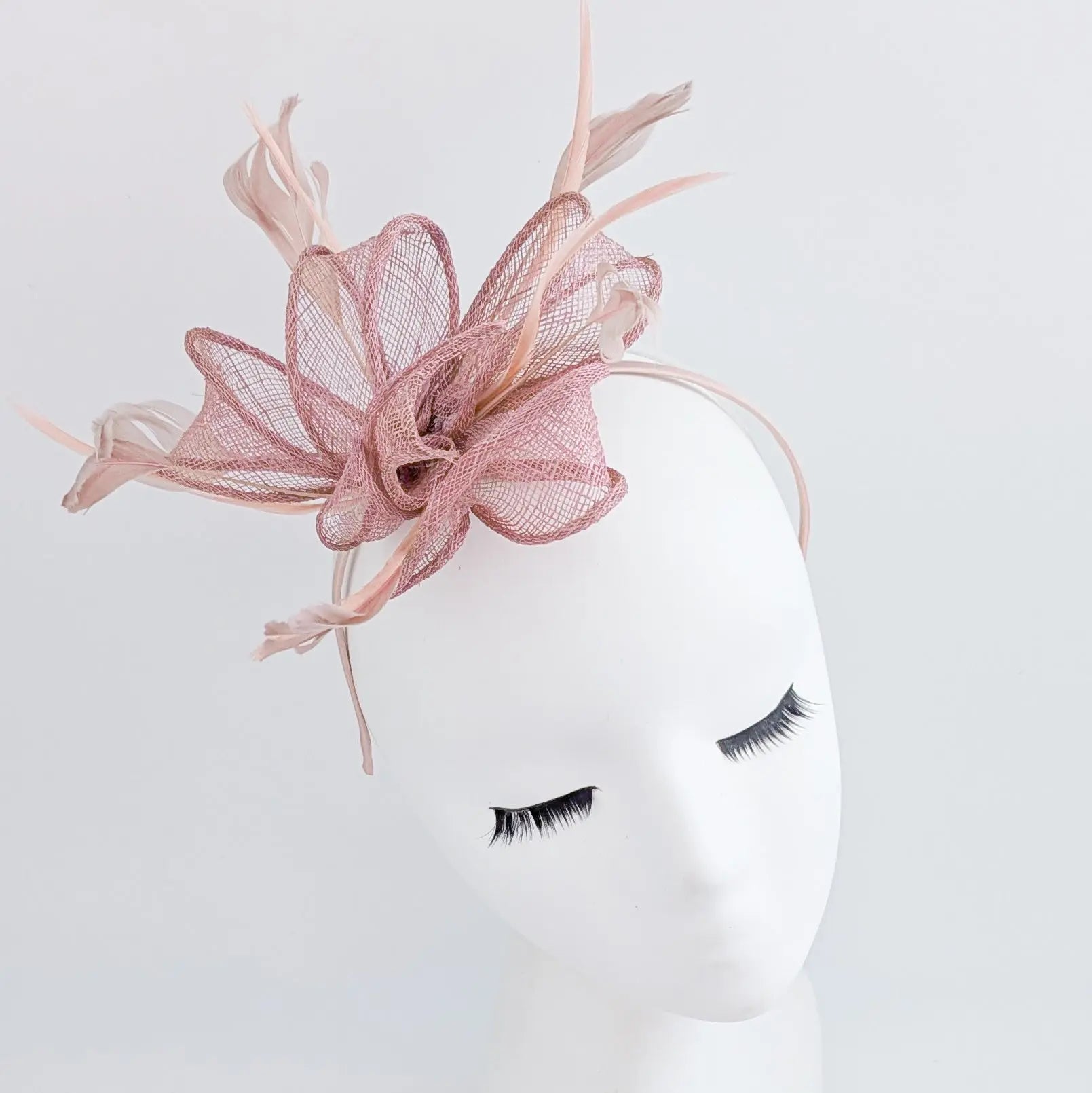 Blush pink feather fascinator hat House of Hats