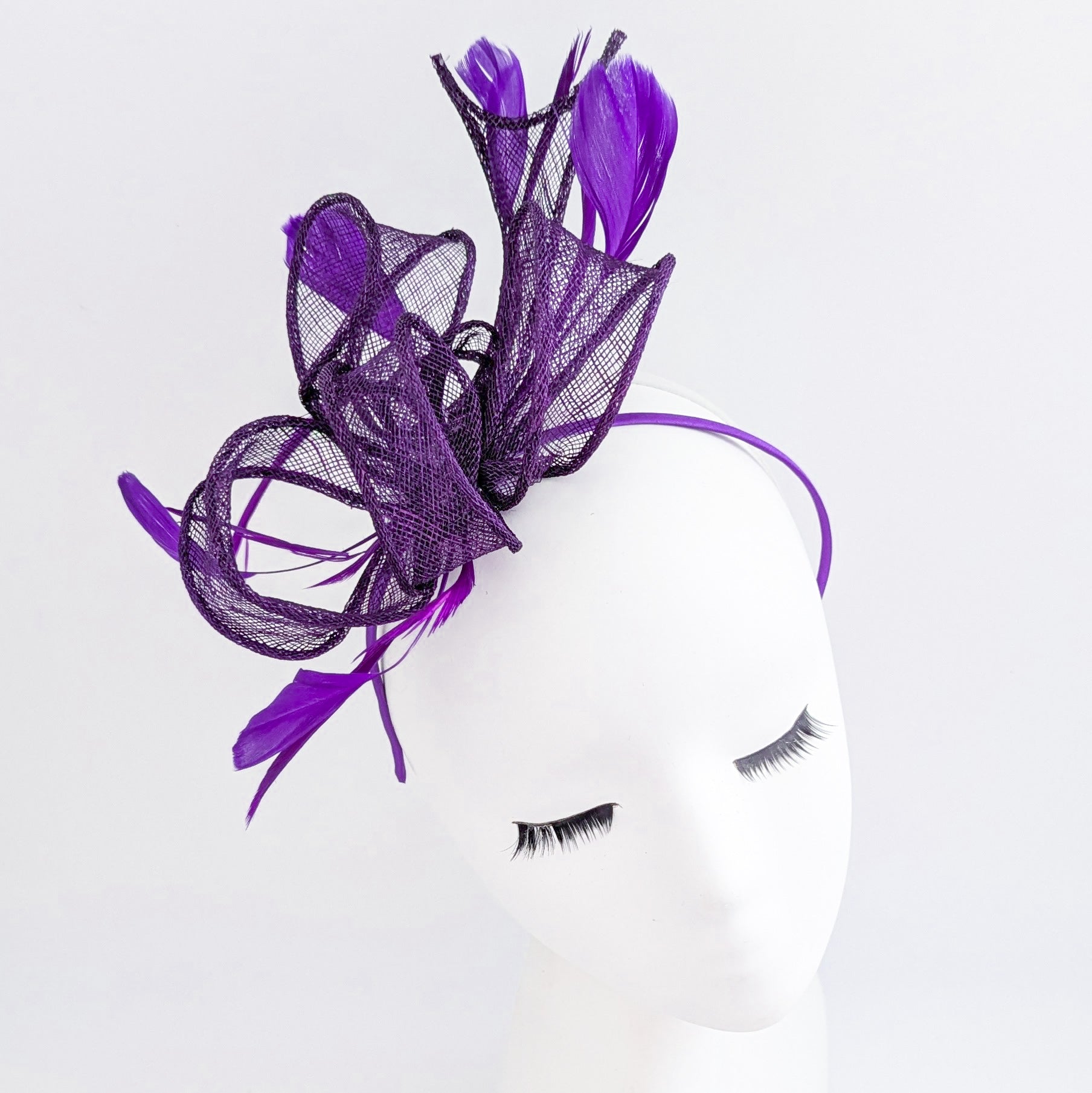 Aubergine cadbury purple feather fascinator hat