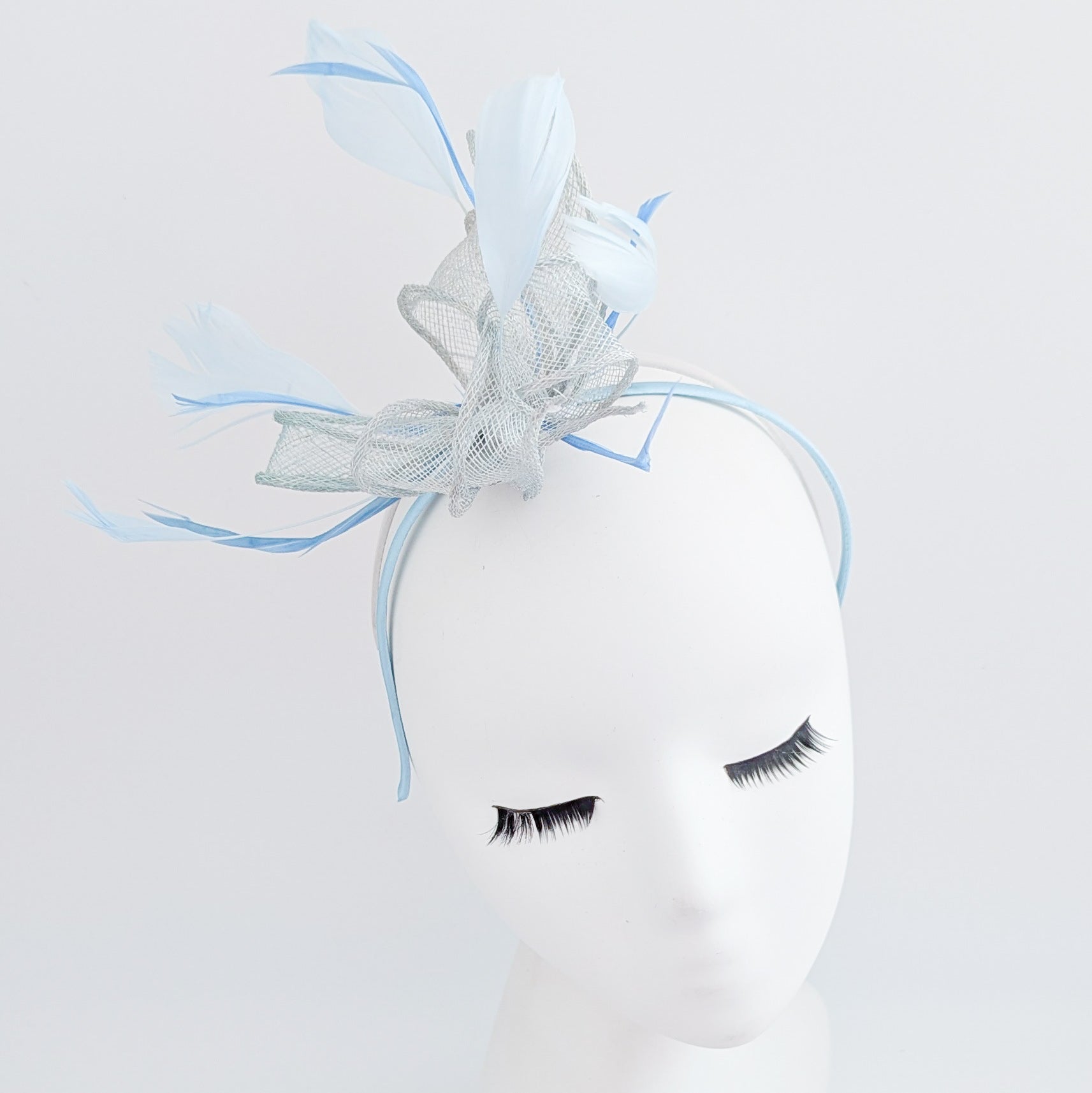 Aquamarine blue feather fascinator hat