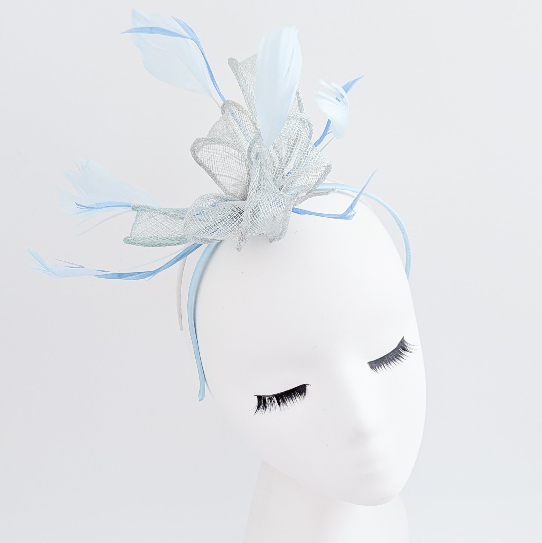 Aquamarine blue feather fascinator hat