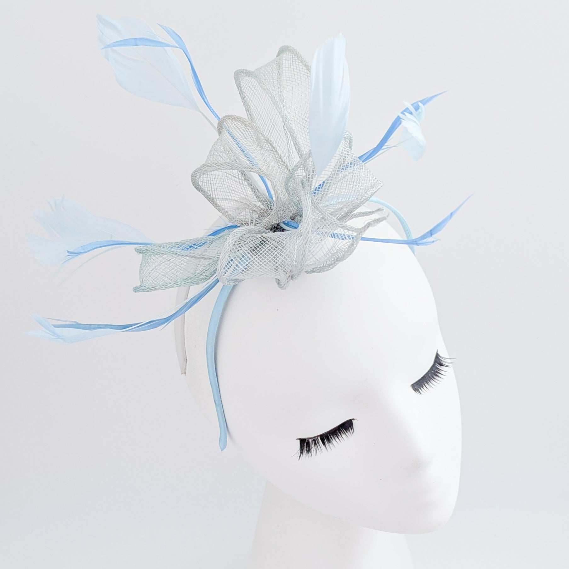 Aquamarine blue feather fascinator hat