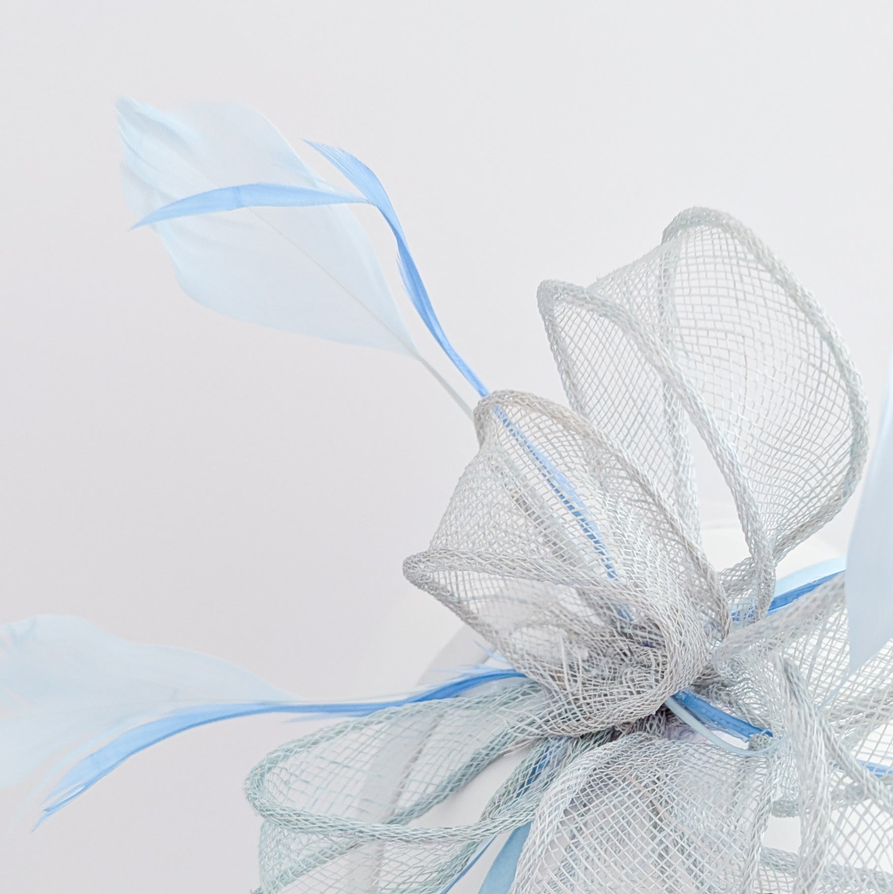 Aquamarine blue feather fascinator hat