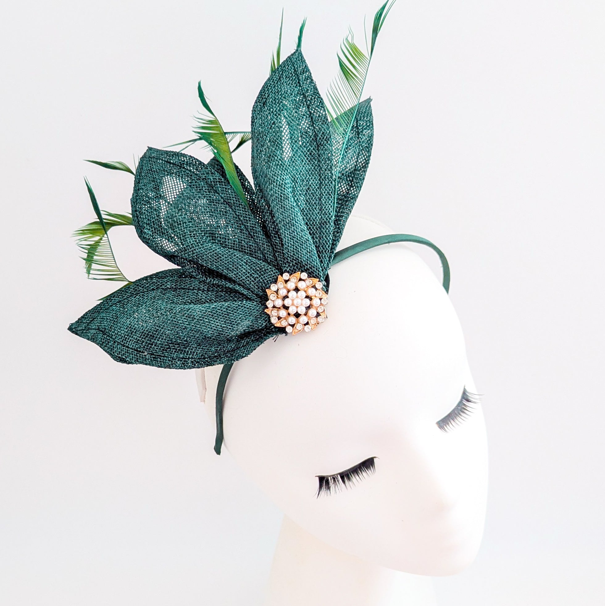 Dark emerald green feather petal fan fascinator hat