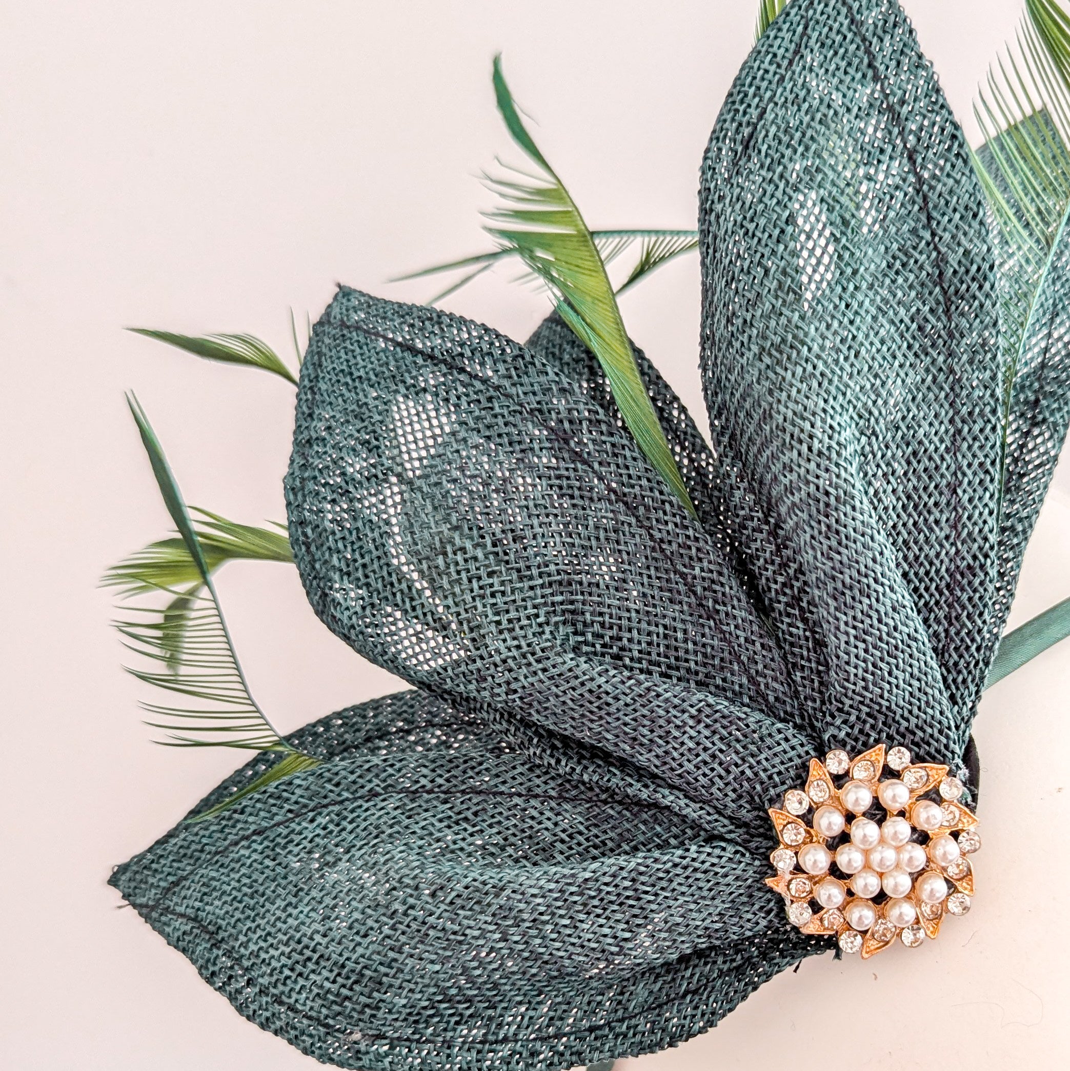 Dark emerald green feather petal fan fascinator hat