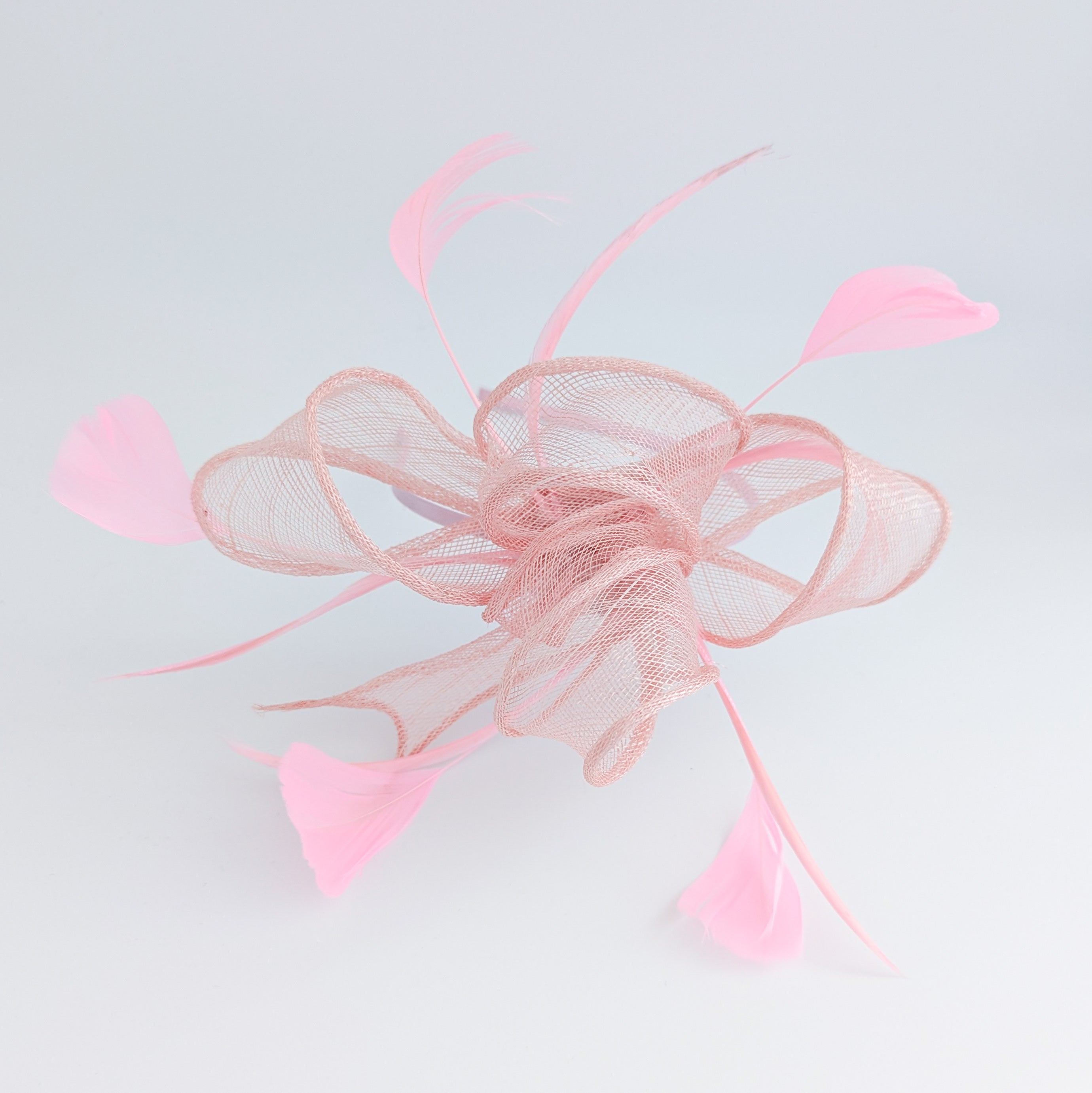 Light peach pink feather fascinator hat