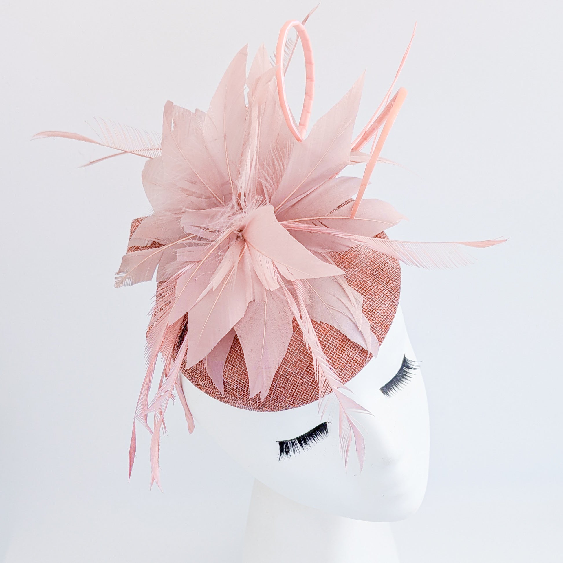 Blush pink feather fascinator hat