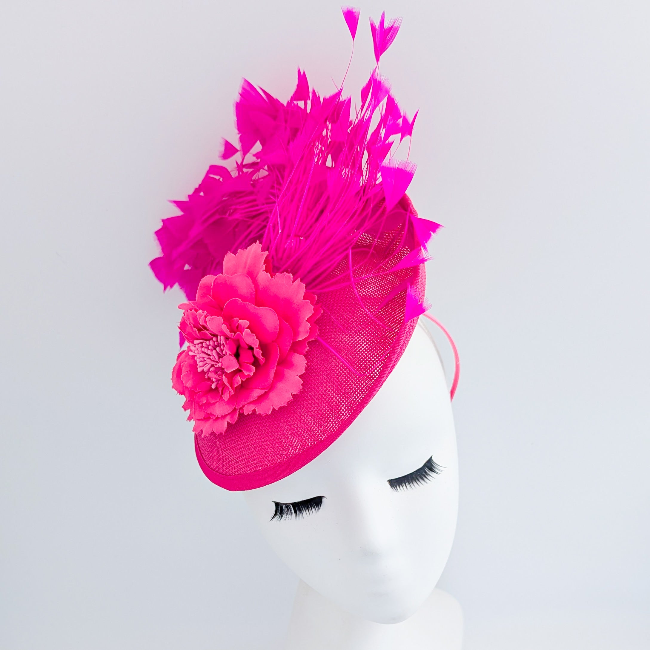 Fuchsia pink flower feather disc saucer fascinator hat