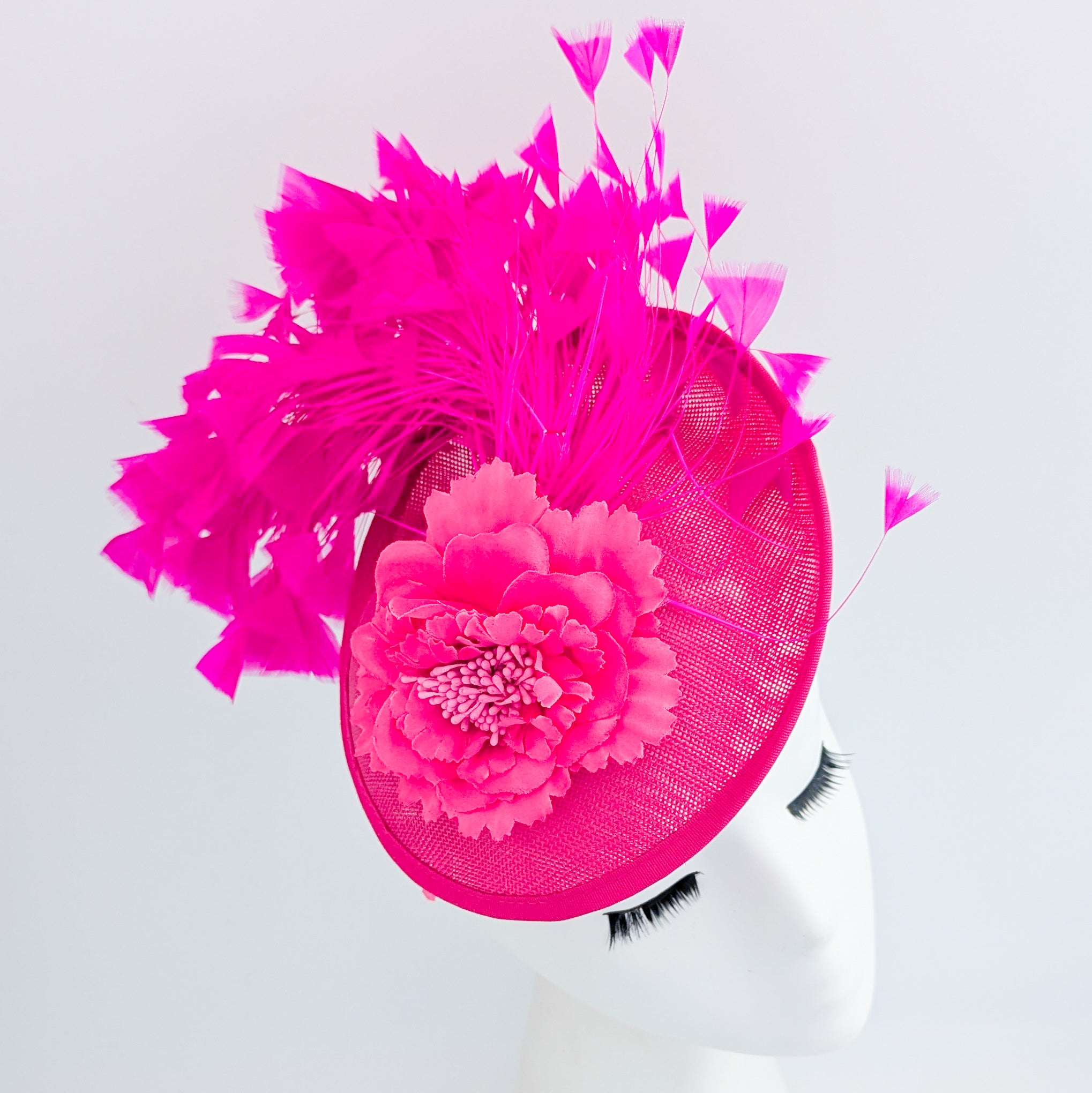 Fuchsia pink flower feather disc saucer fascinator hat