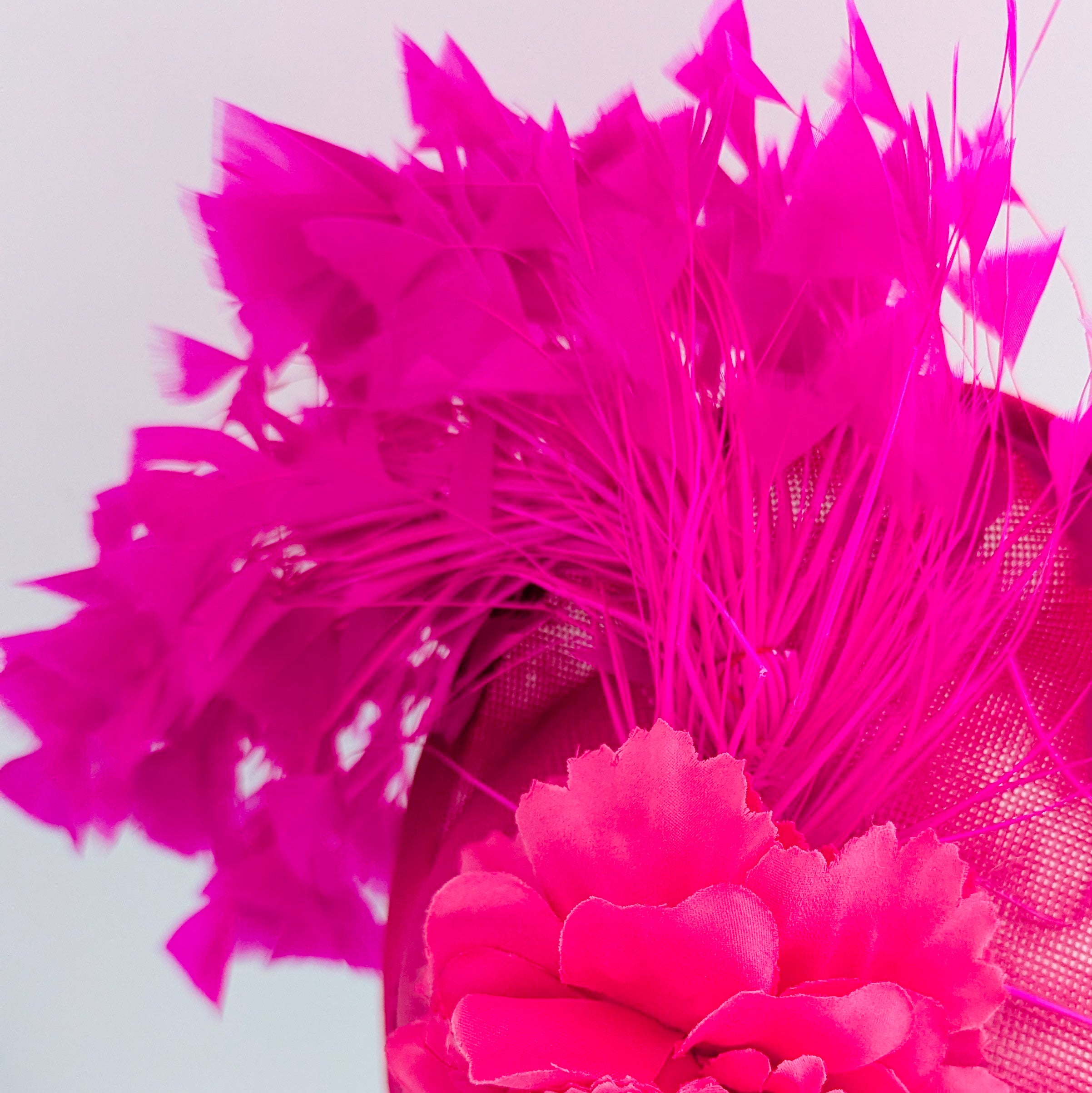 Fuchsia pink flower feather disc saucer fascinator hat