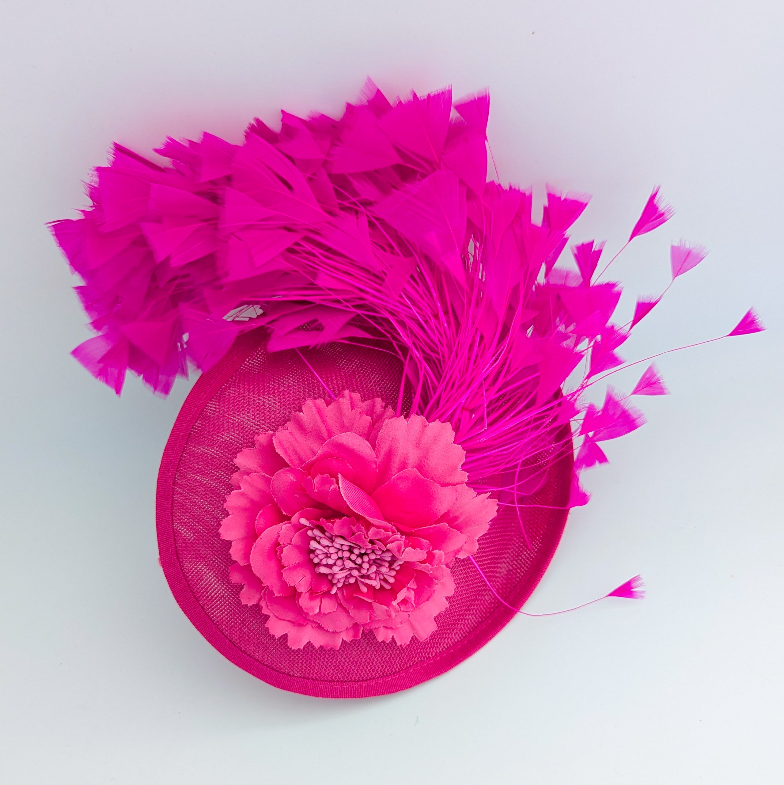 Fuchsia pink flower feather disc saucer fascinator hat