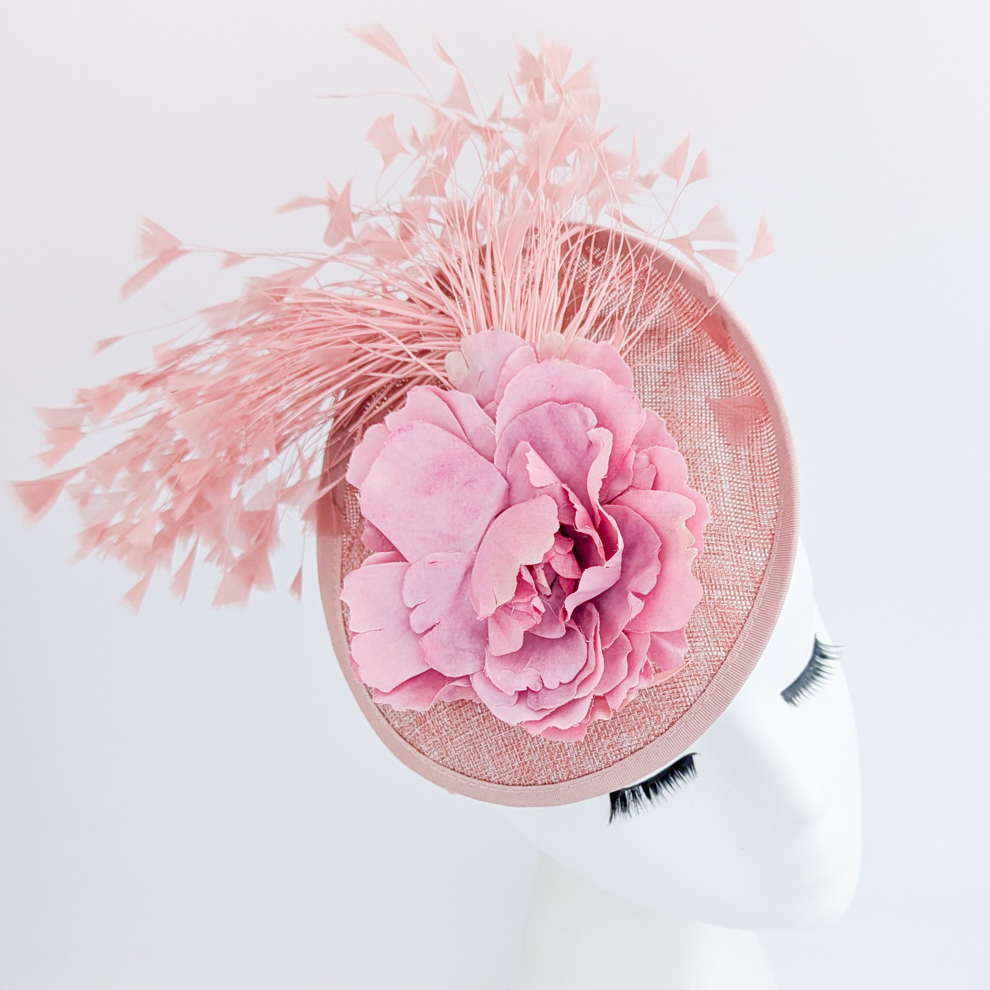 Blush pink flower feather disc saucer fascinator hat