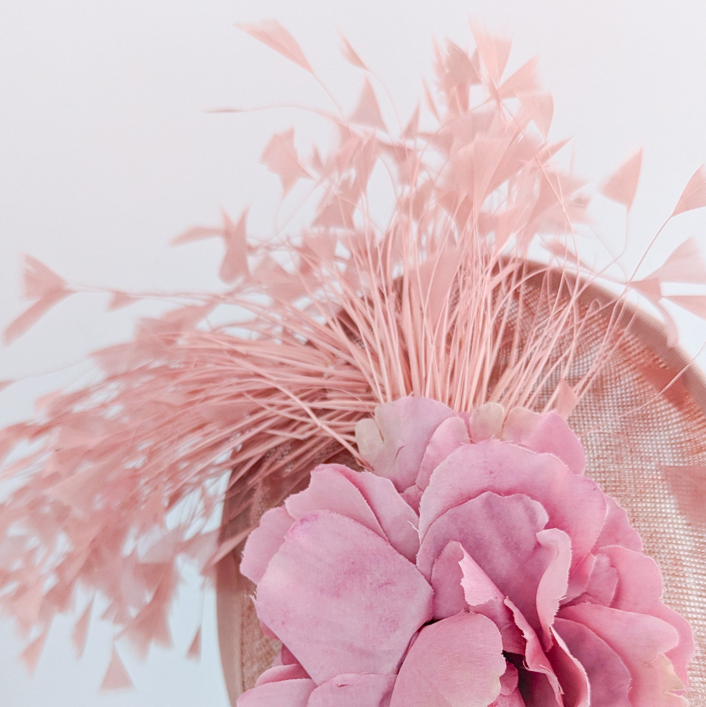 Blush pink flower feather disc saucer fascinator hat