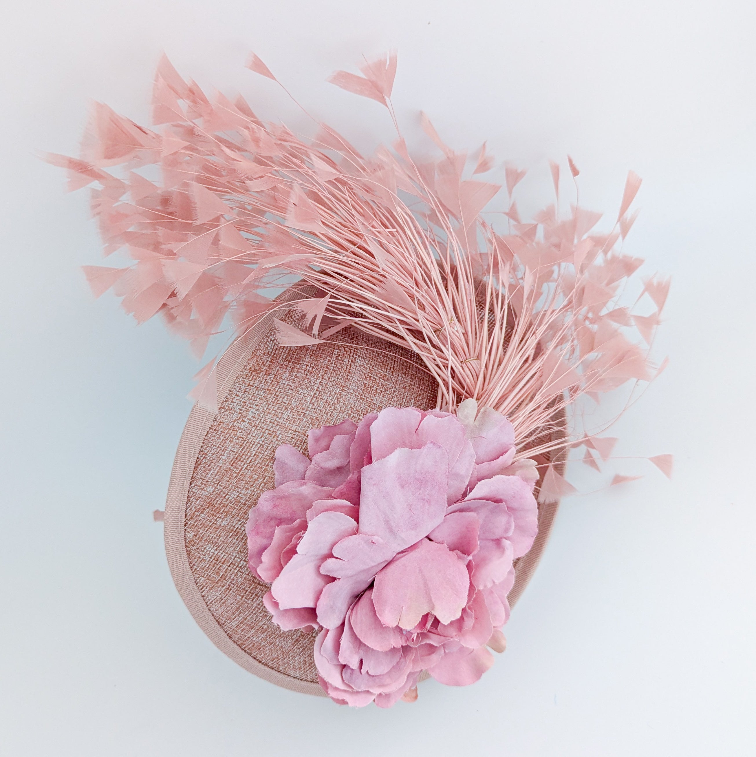 Blush pink flower feather disc saucer fascinator hat
