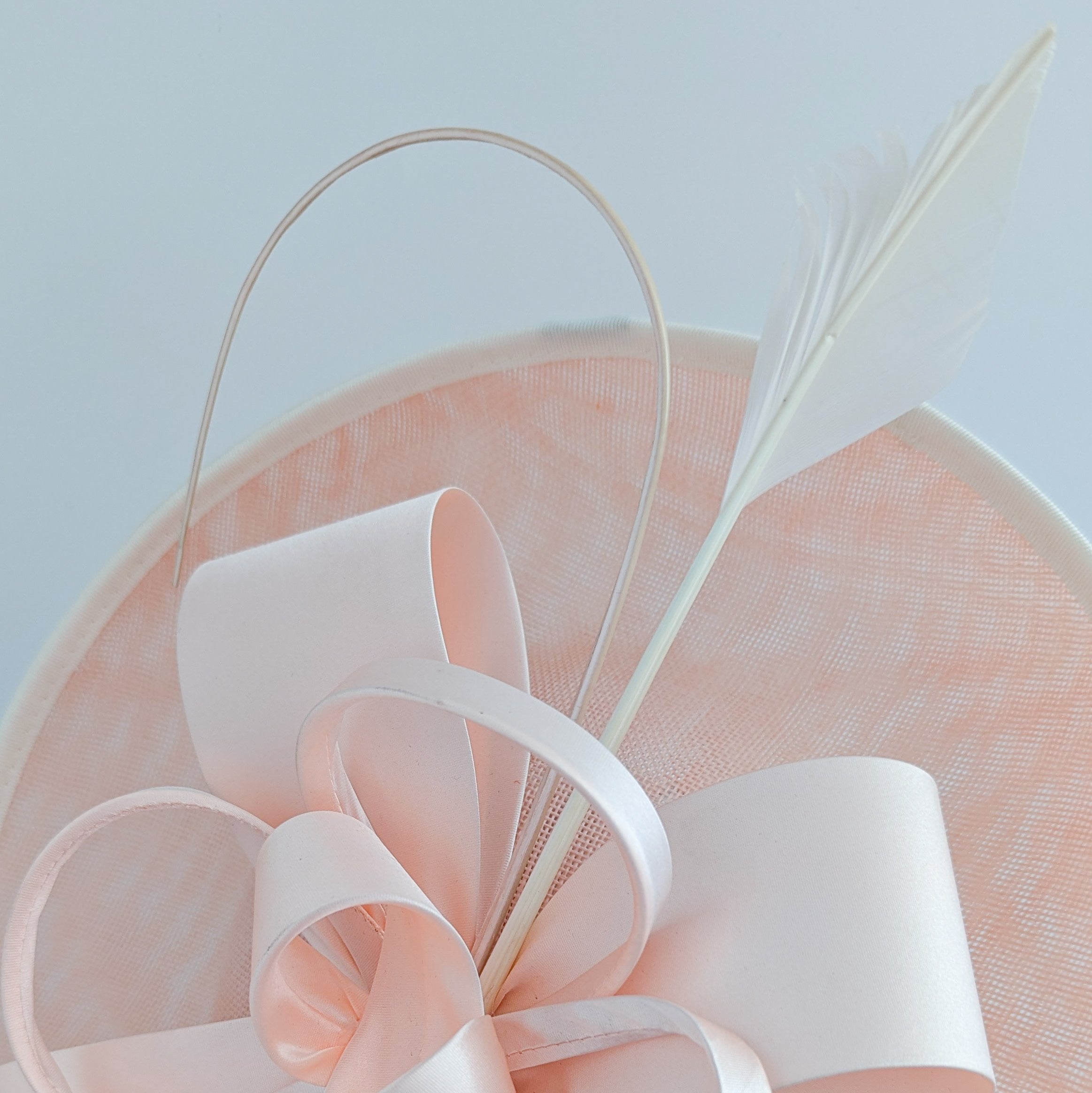 Light pink feather large saucer disc fascinator hat