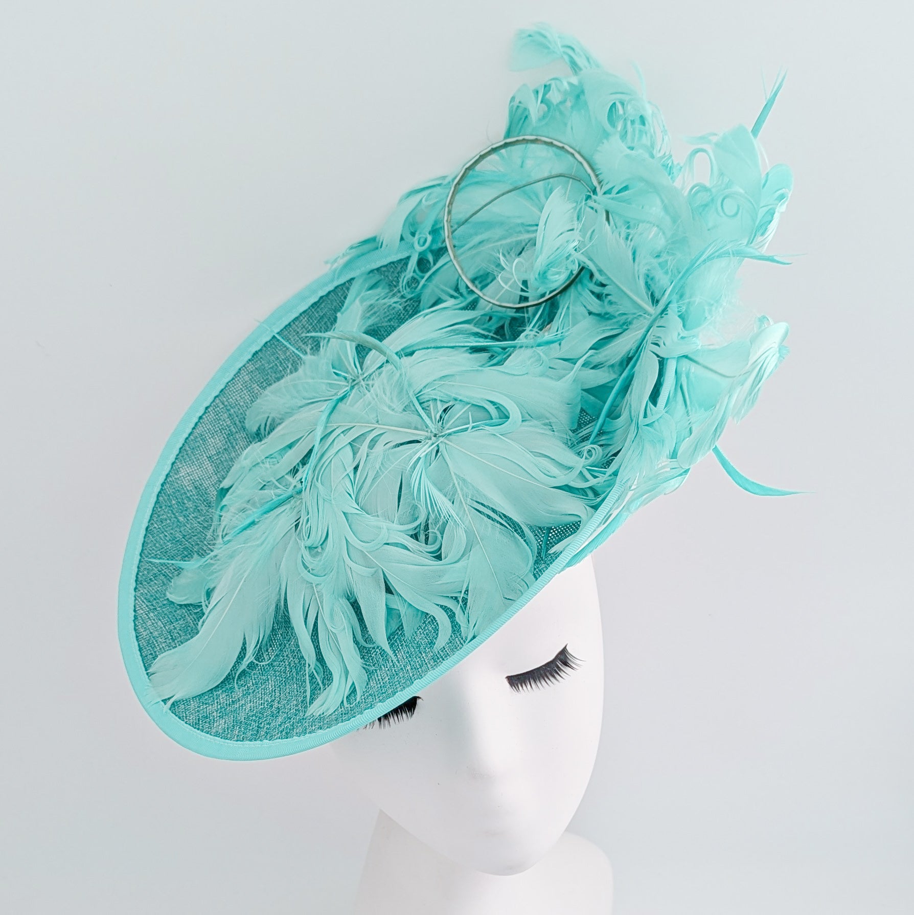 Light turquoise green blue large feather saucer disc fascinator hat